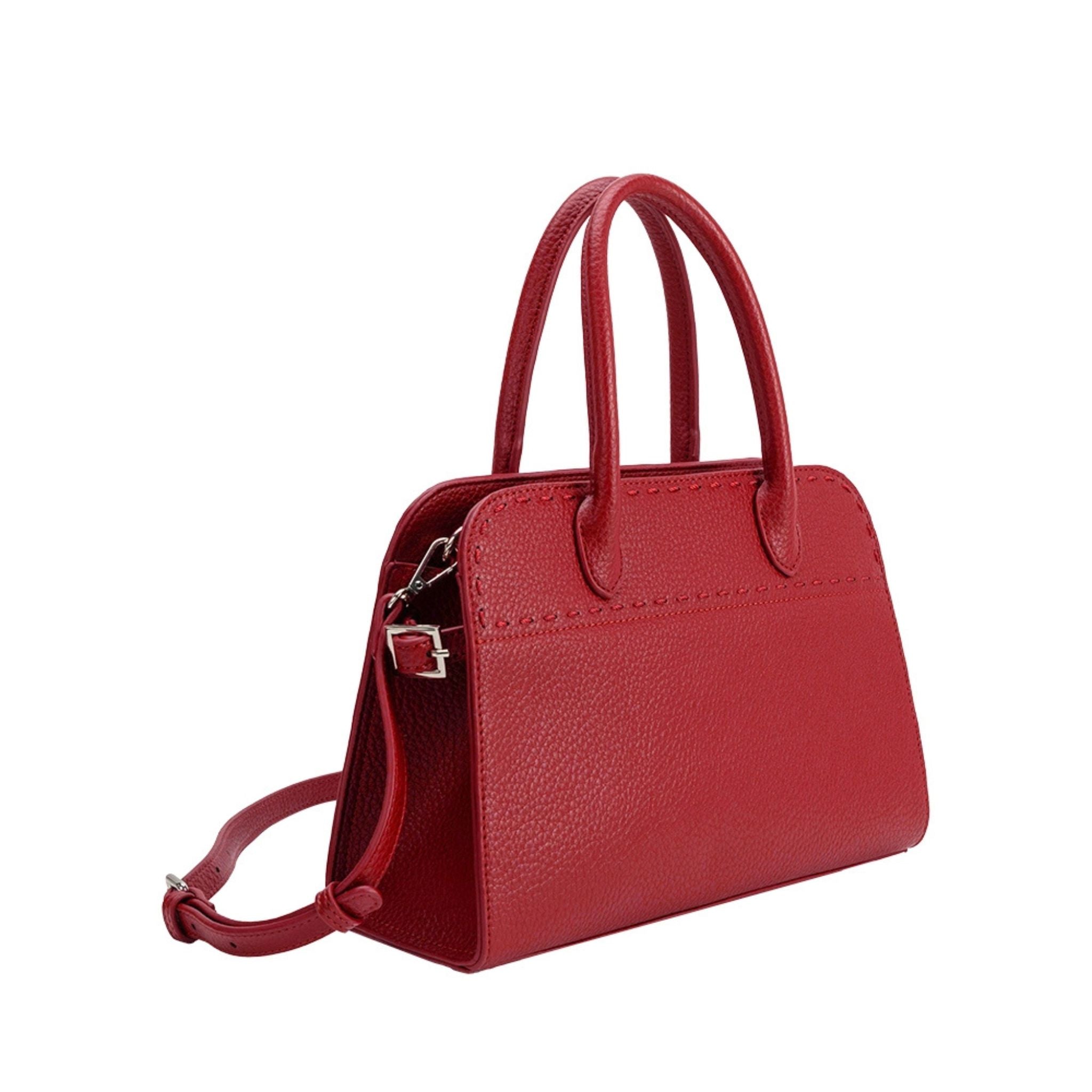 Red handbag with a strap on a white background