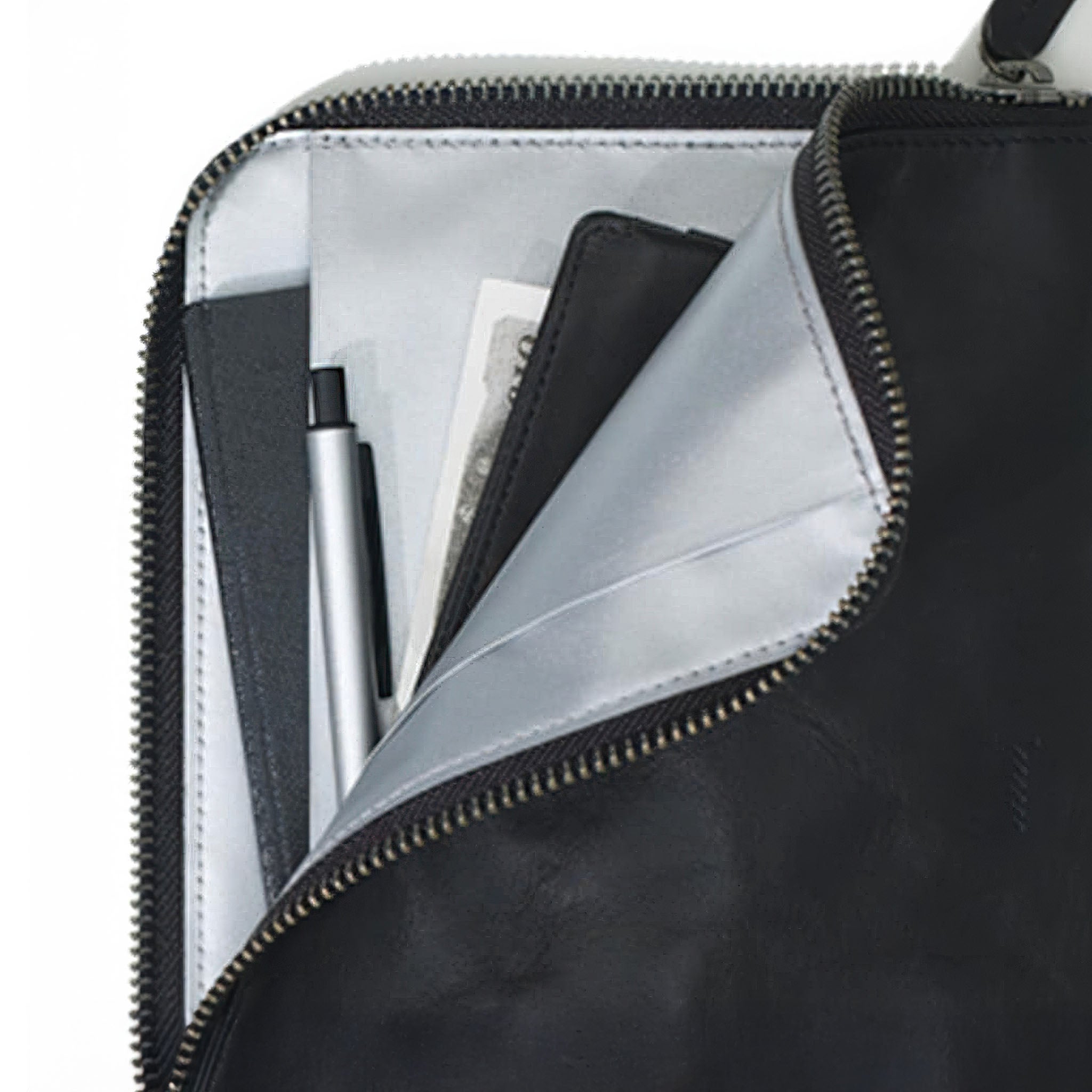 hmny's 10 mile bag with interior compartments and a pen visible
