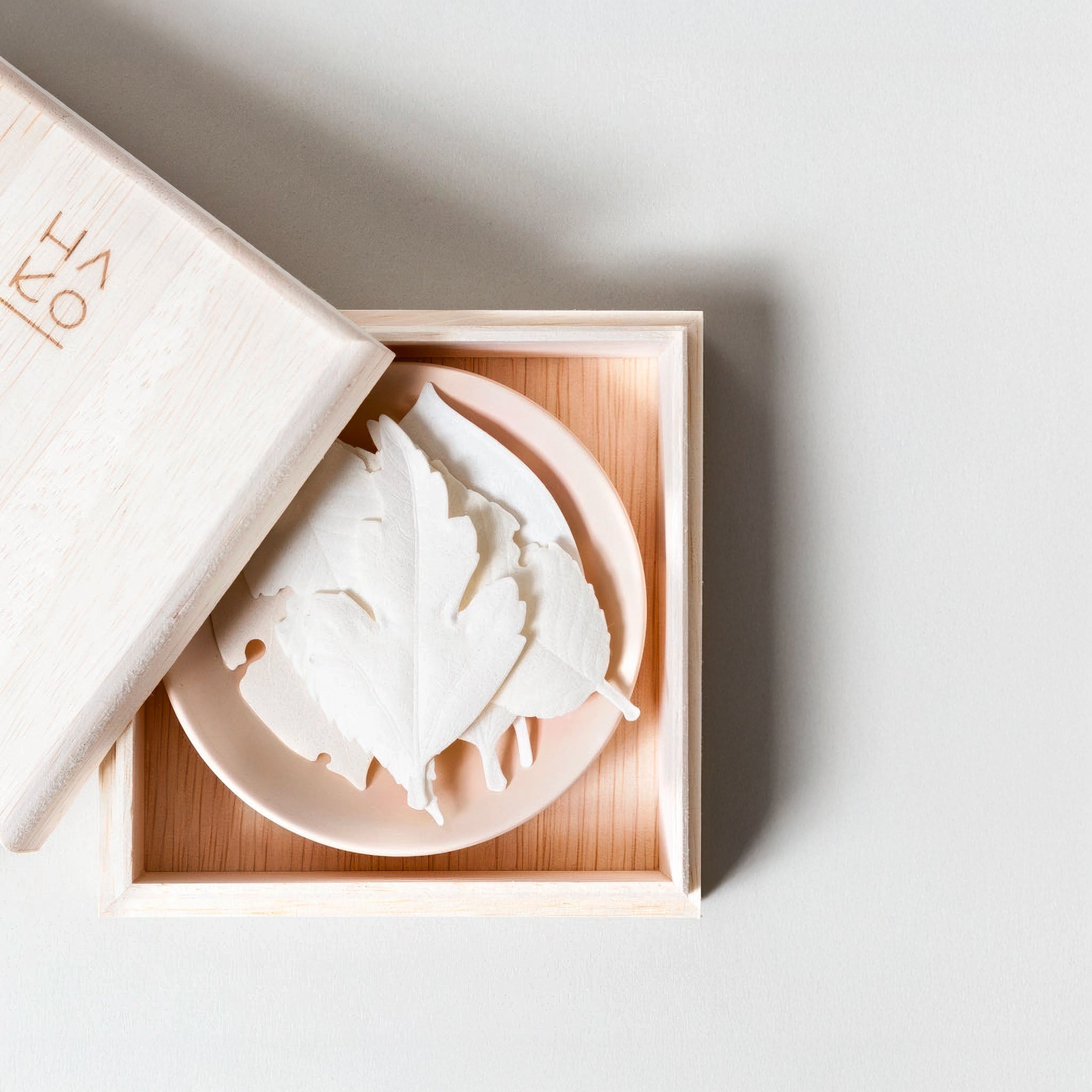 Ha Ko incense kit opened showing the leaf incense design in a wooden box on a light gray background