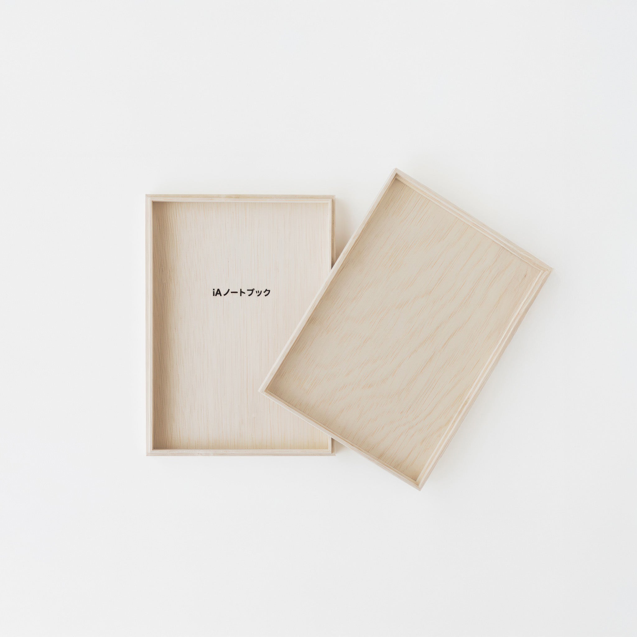 Minimalist iA notebook for writers' wooden box on a white background,