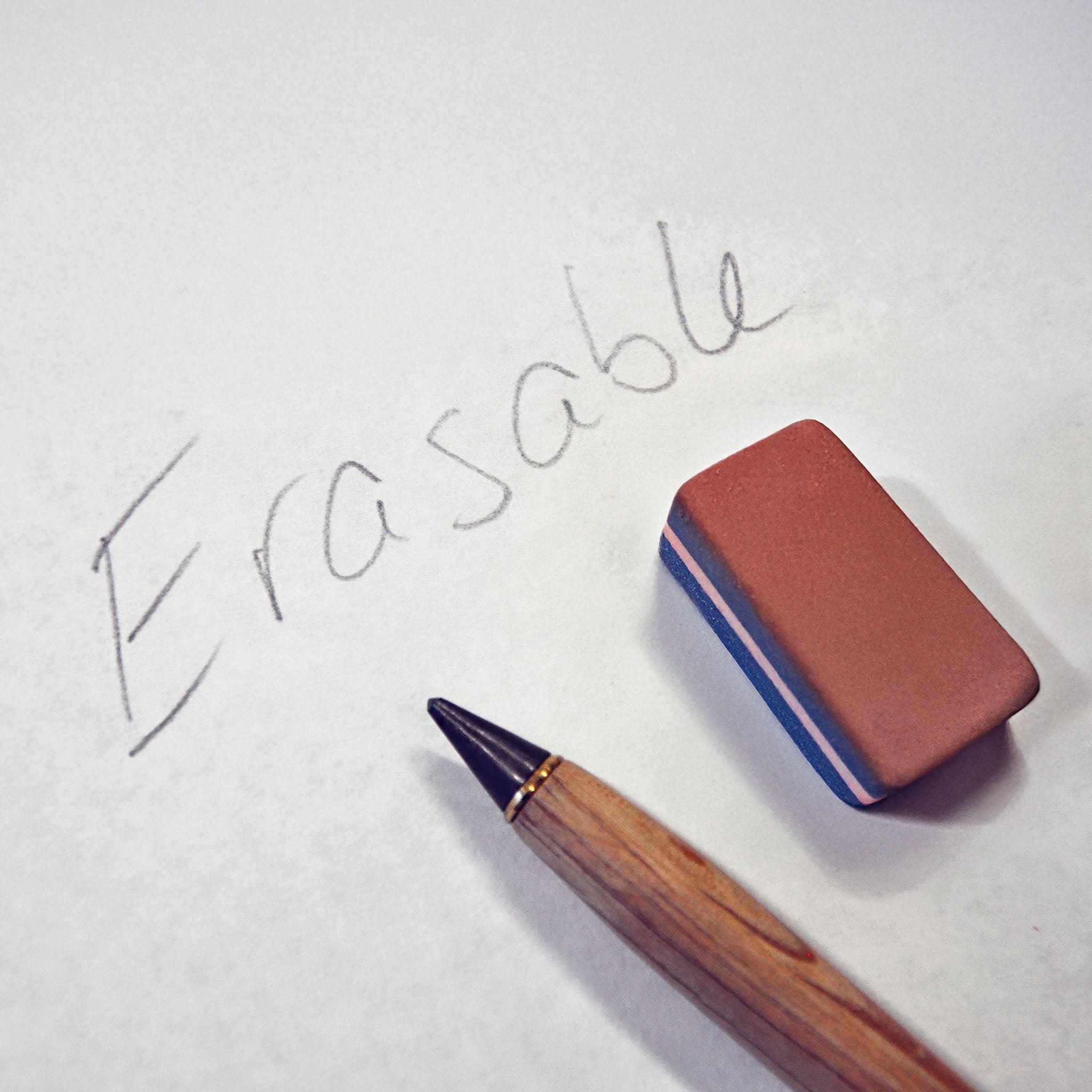 Eraser and pencil on a white background with 'Erasable' text.