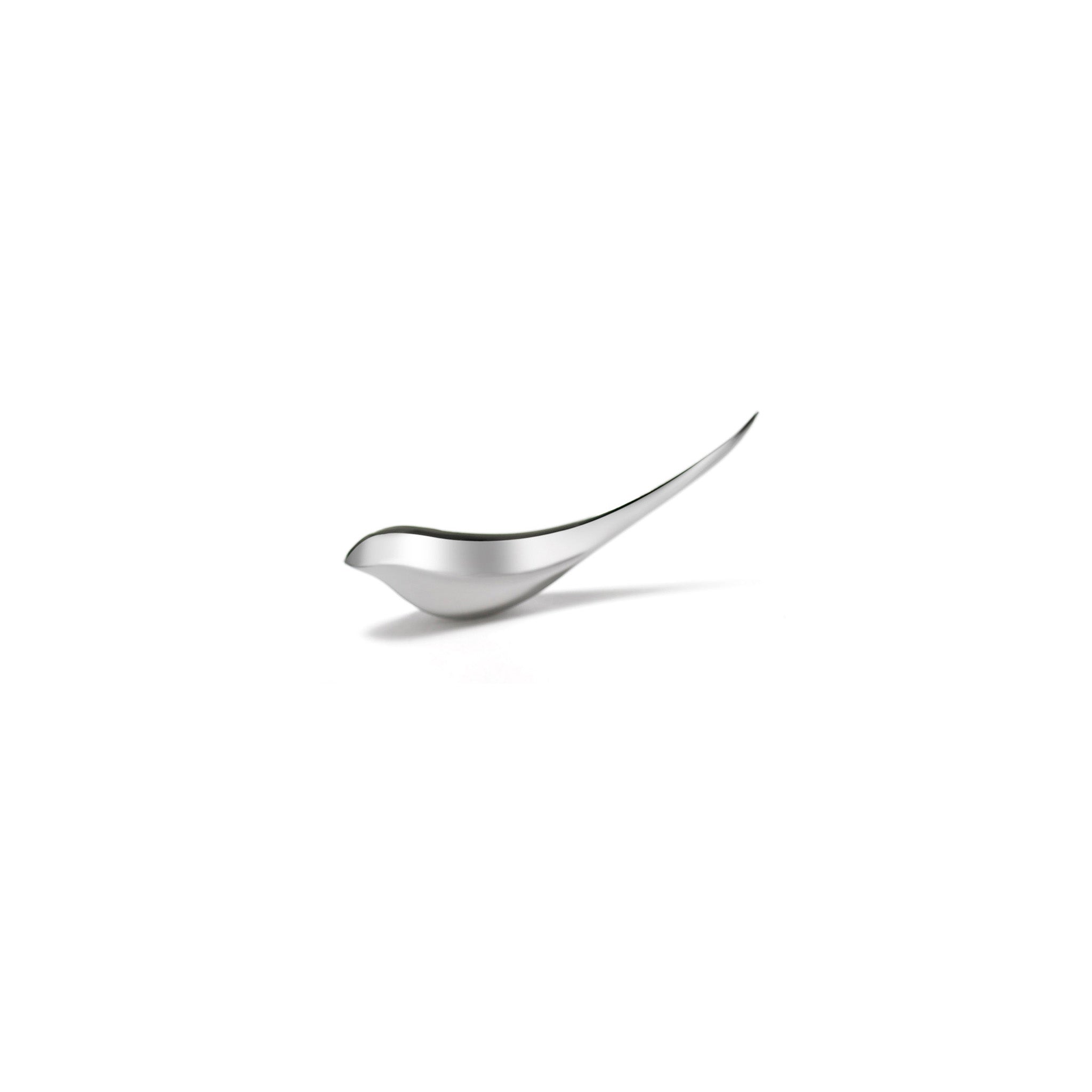 Silver bird shaped letter opener on a white background