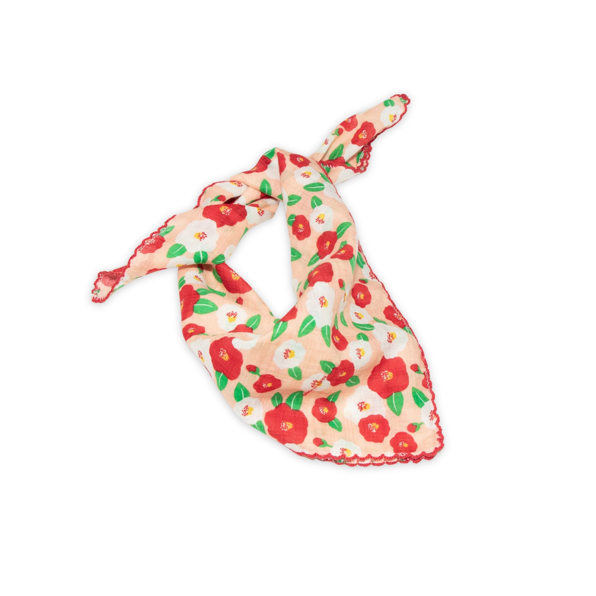 Floral patterned scarf on a white background with red and peach colors prominent
