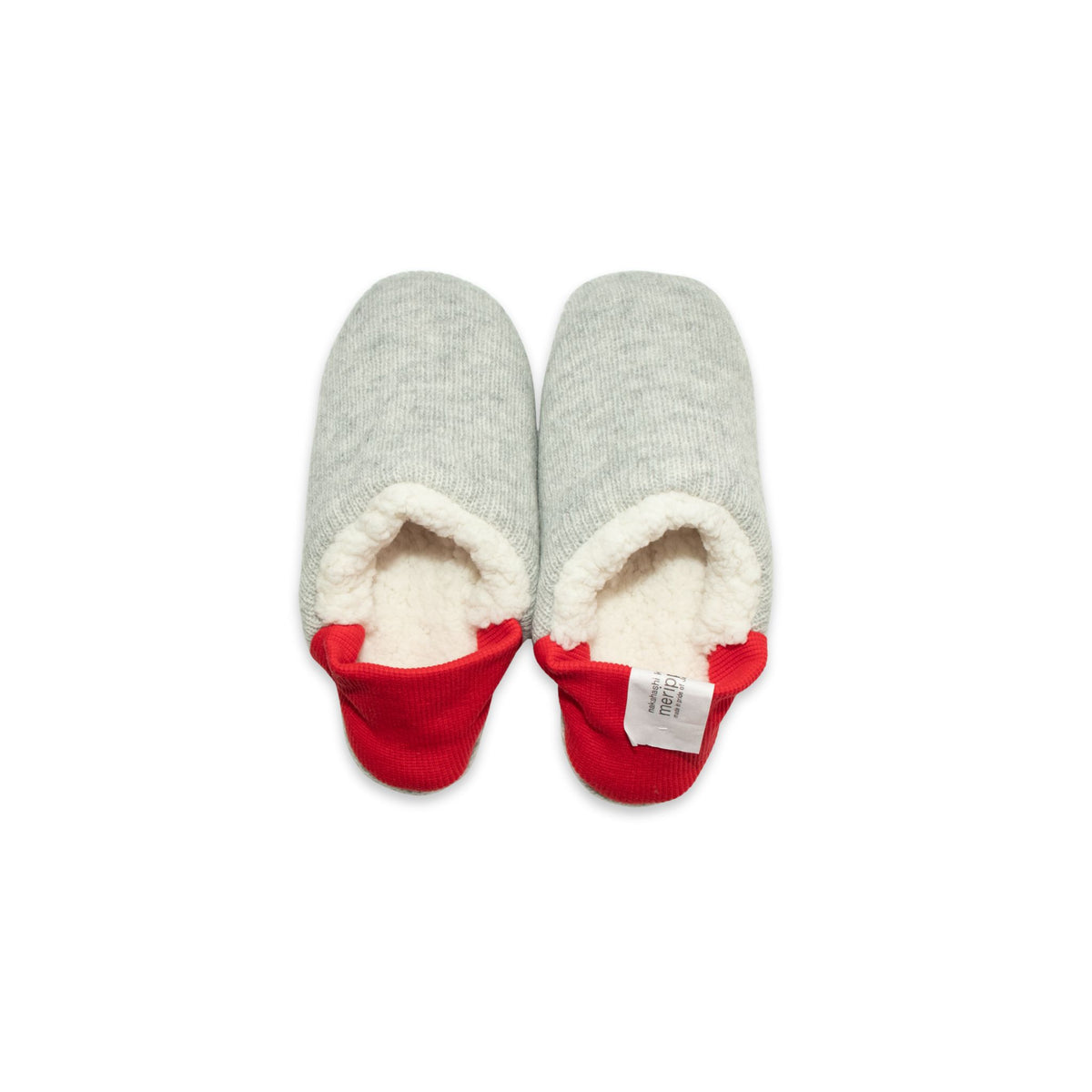 A pair of grey colored slippers with red trim on a white background