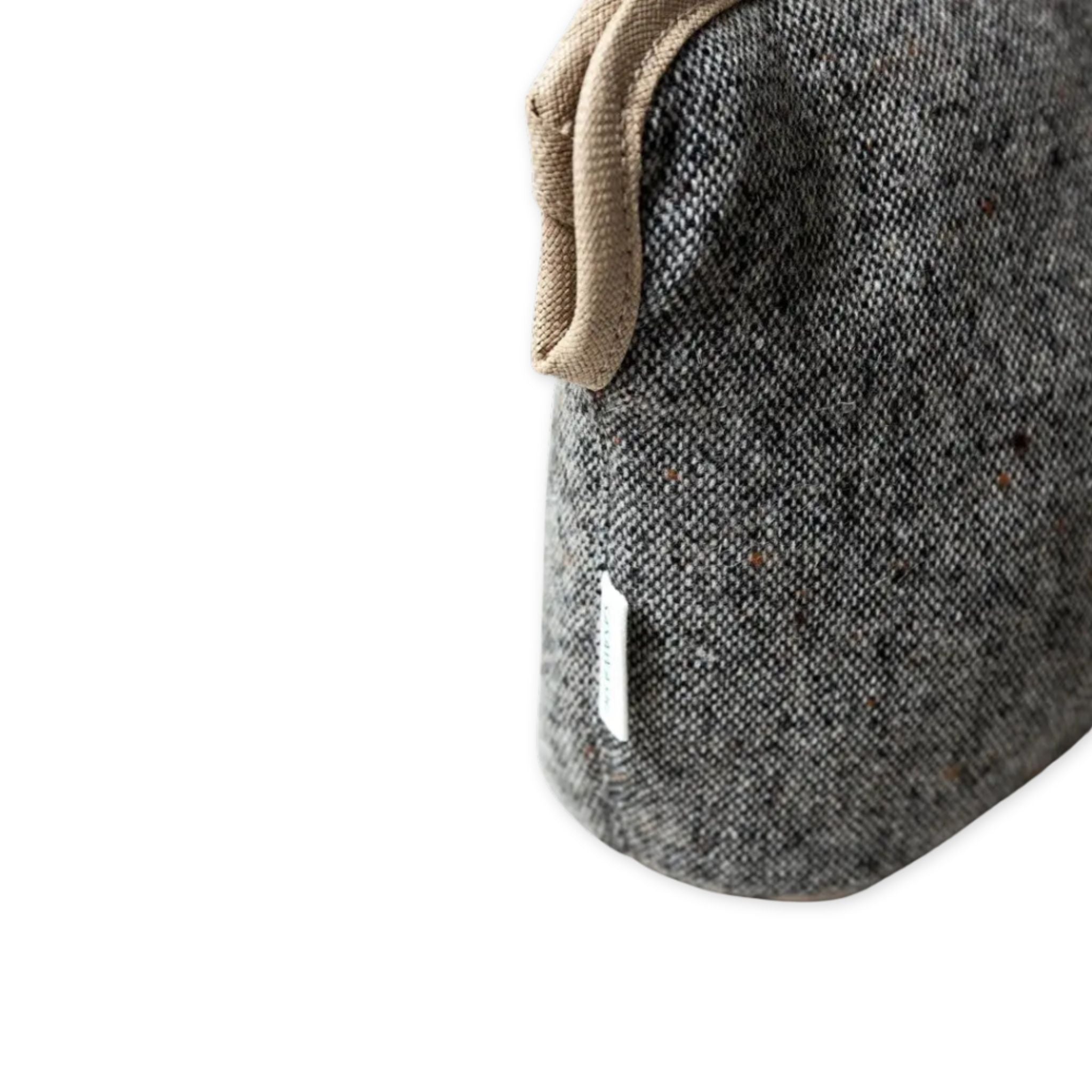 Close-up of grey slipper boots with a beige strap on a white background