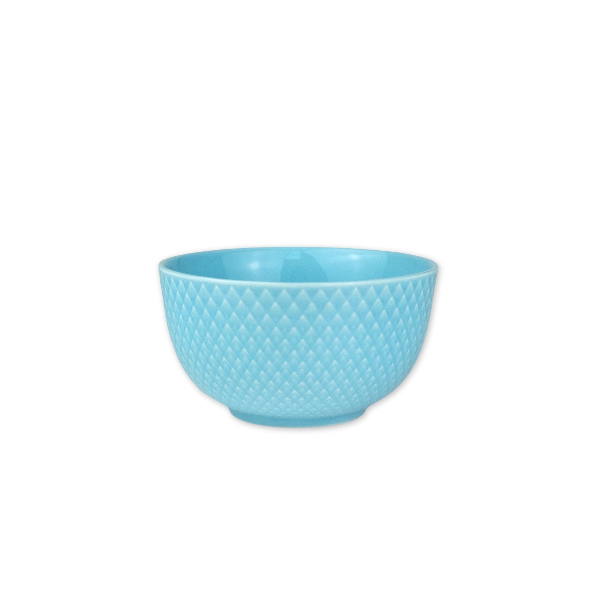 Turquoise textured bowl on a white background