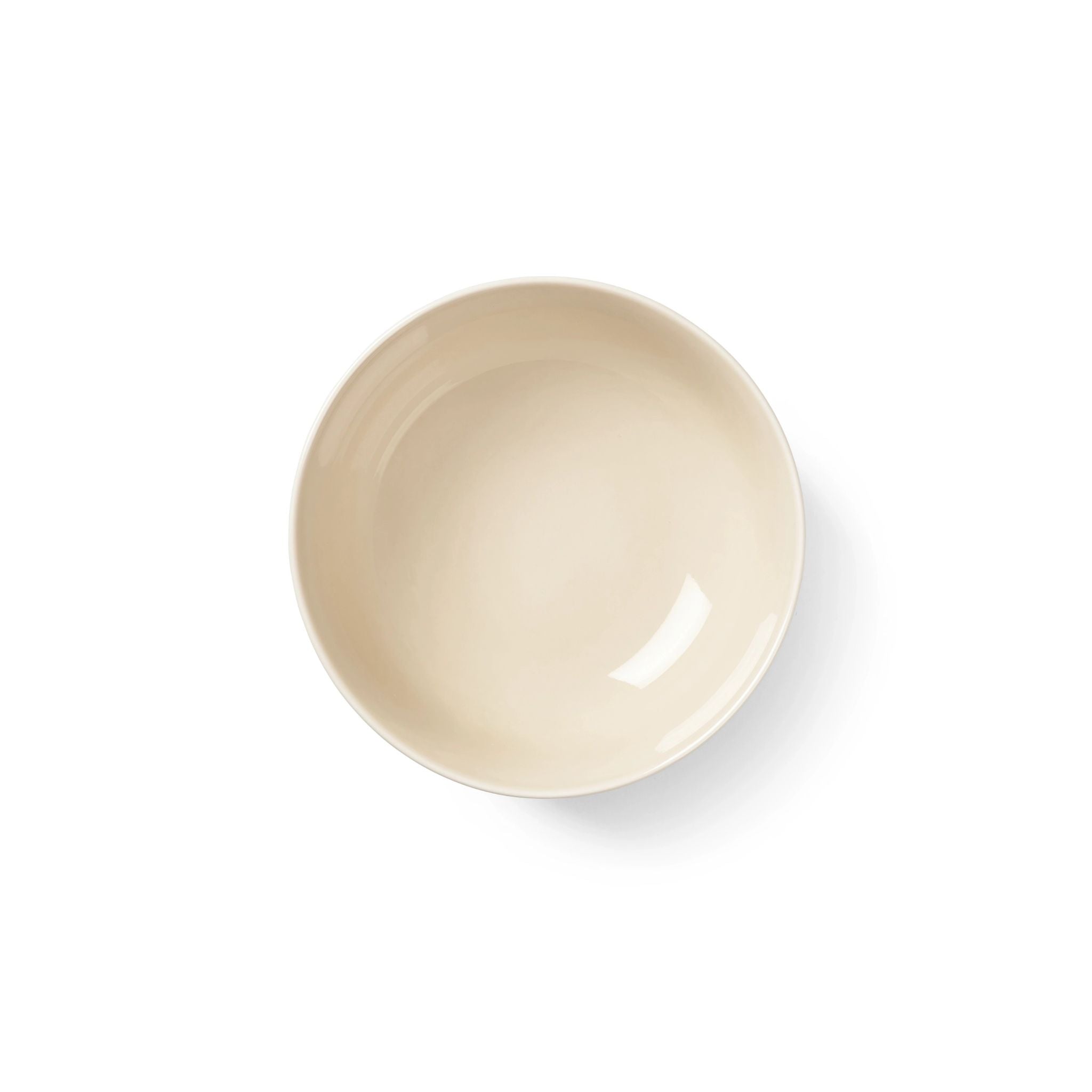 Top view of beige ceramic porcelain bowl on a white background
