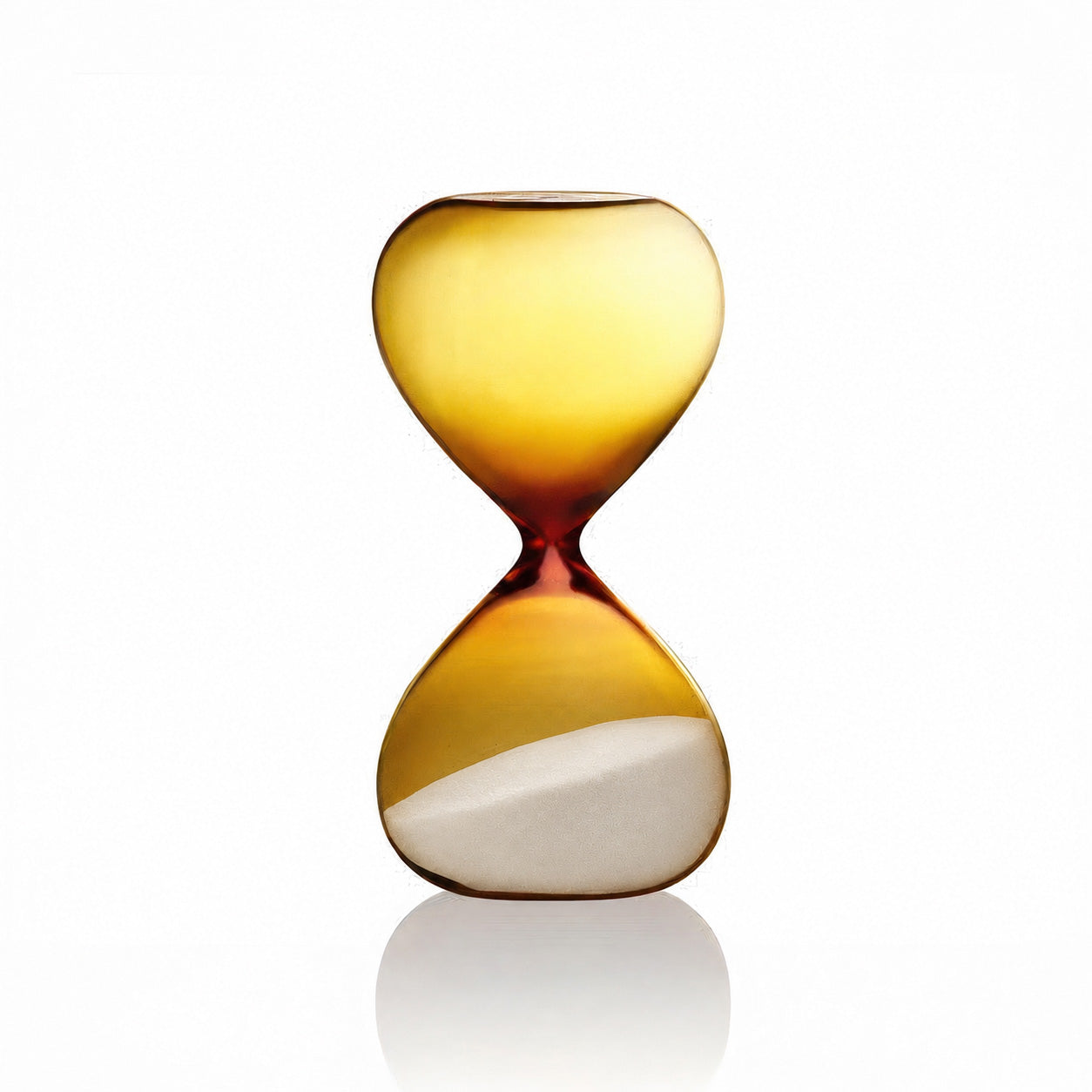A translucent amber glass hourglass with a white sand fill in the lower chamber, set against a clean white background with a soft reflection below.