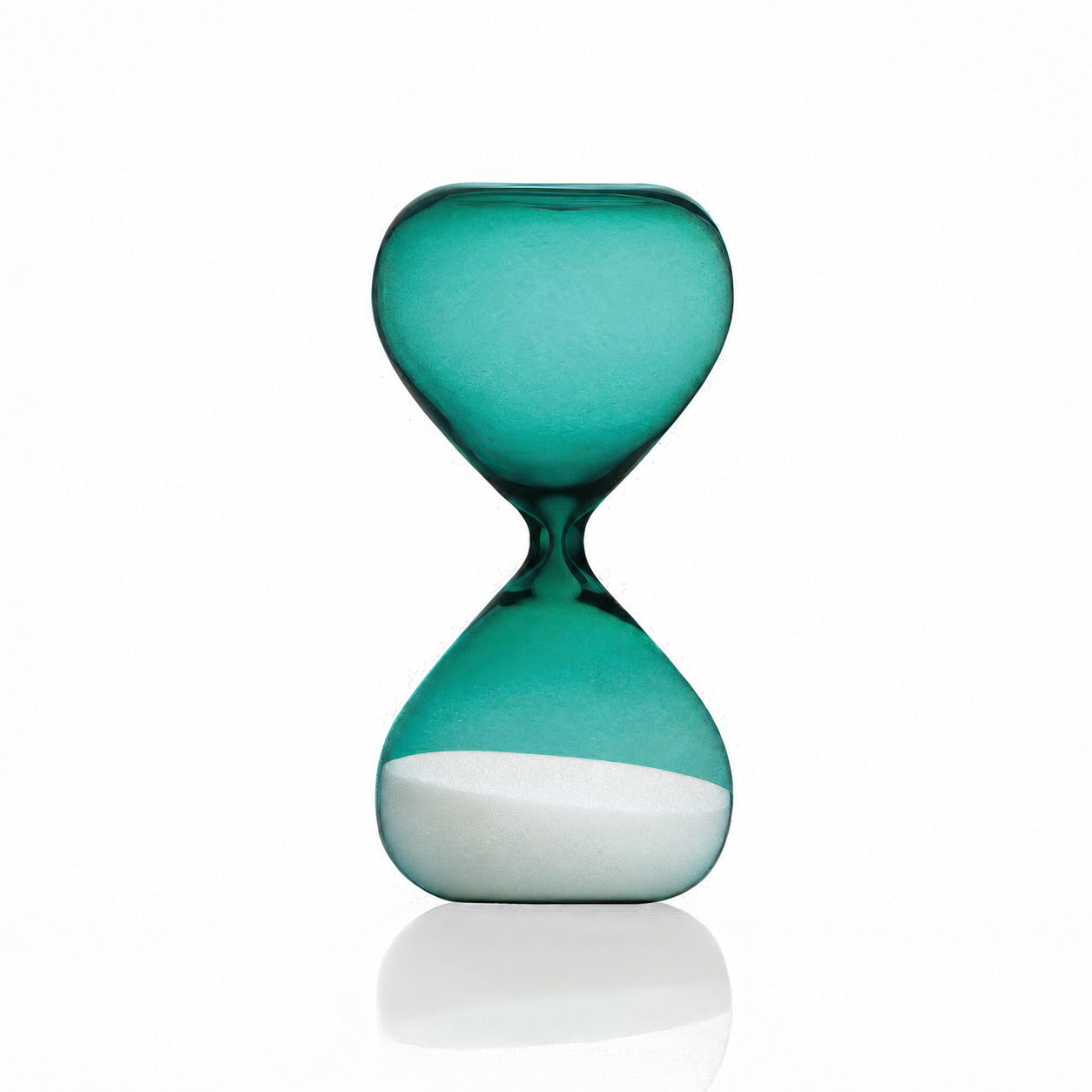 A translucent turquoise glass hourglass with a white sand fill in the lower chamber, set against a clean white background with a soft reflection below.