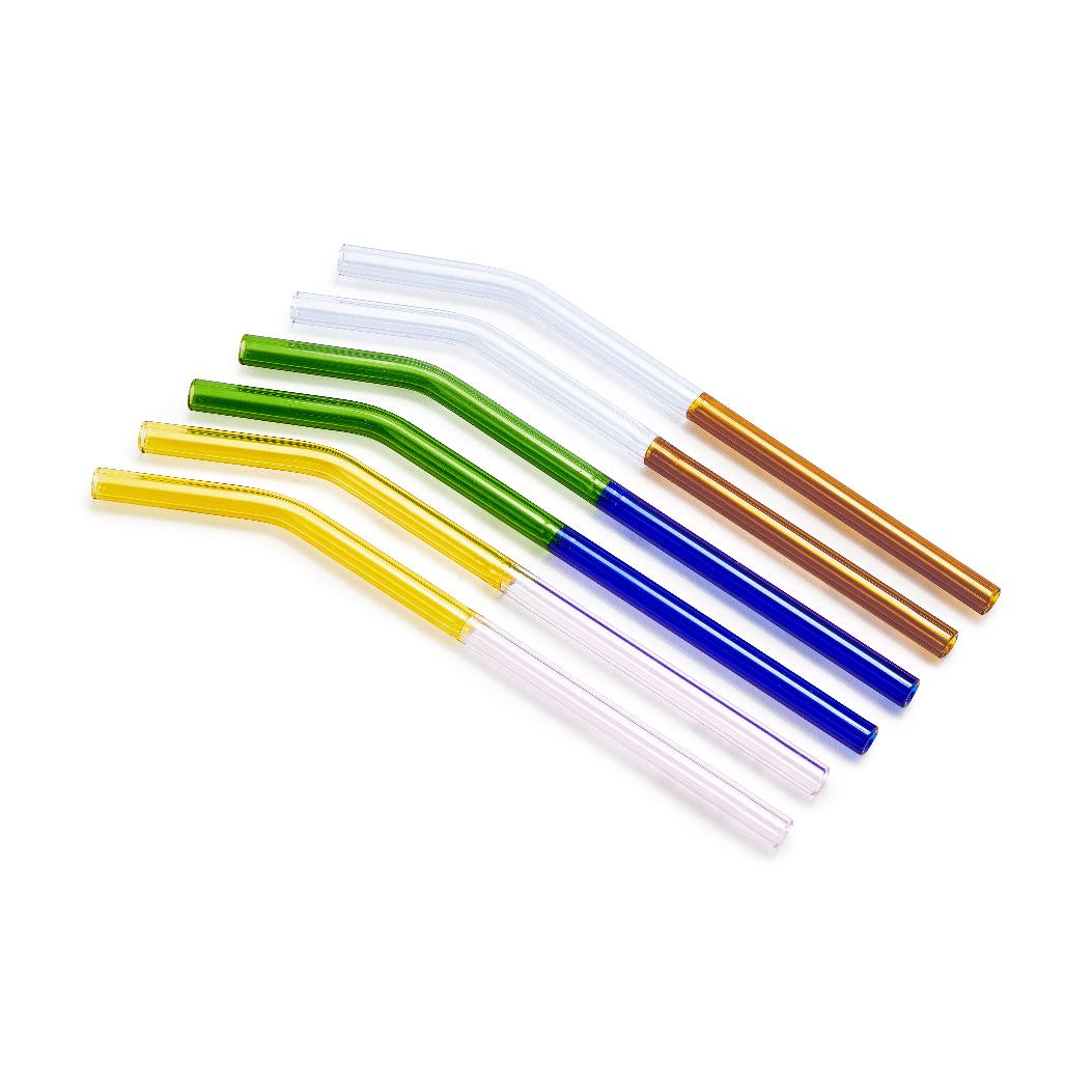 Set of six two-tone borosilicate glass straws in assorted colors (yellow-pink, green-blue, clear-orange) angled on a white background.