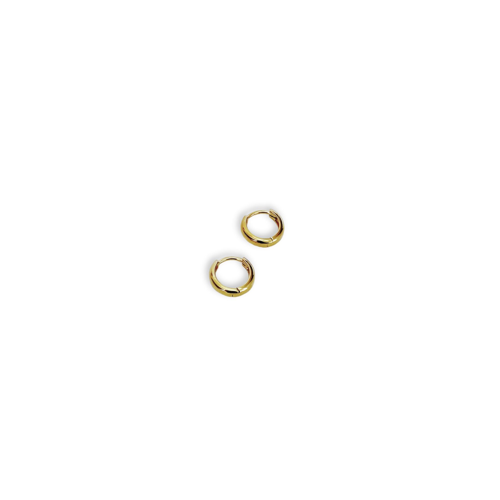 Full view of Kara Yoo's Norma Huggie hoops in gold vermeil