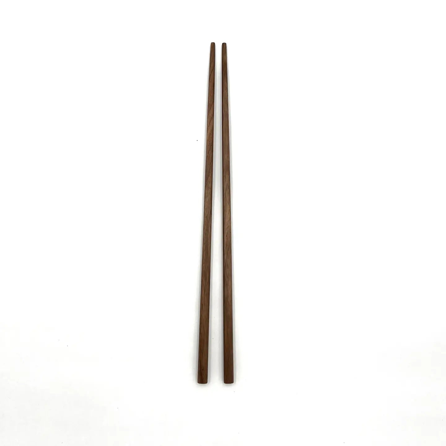 Pair of wooden chopsticks on a white background
