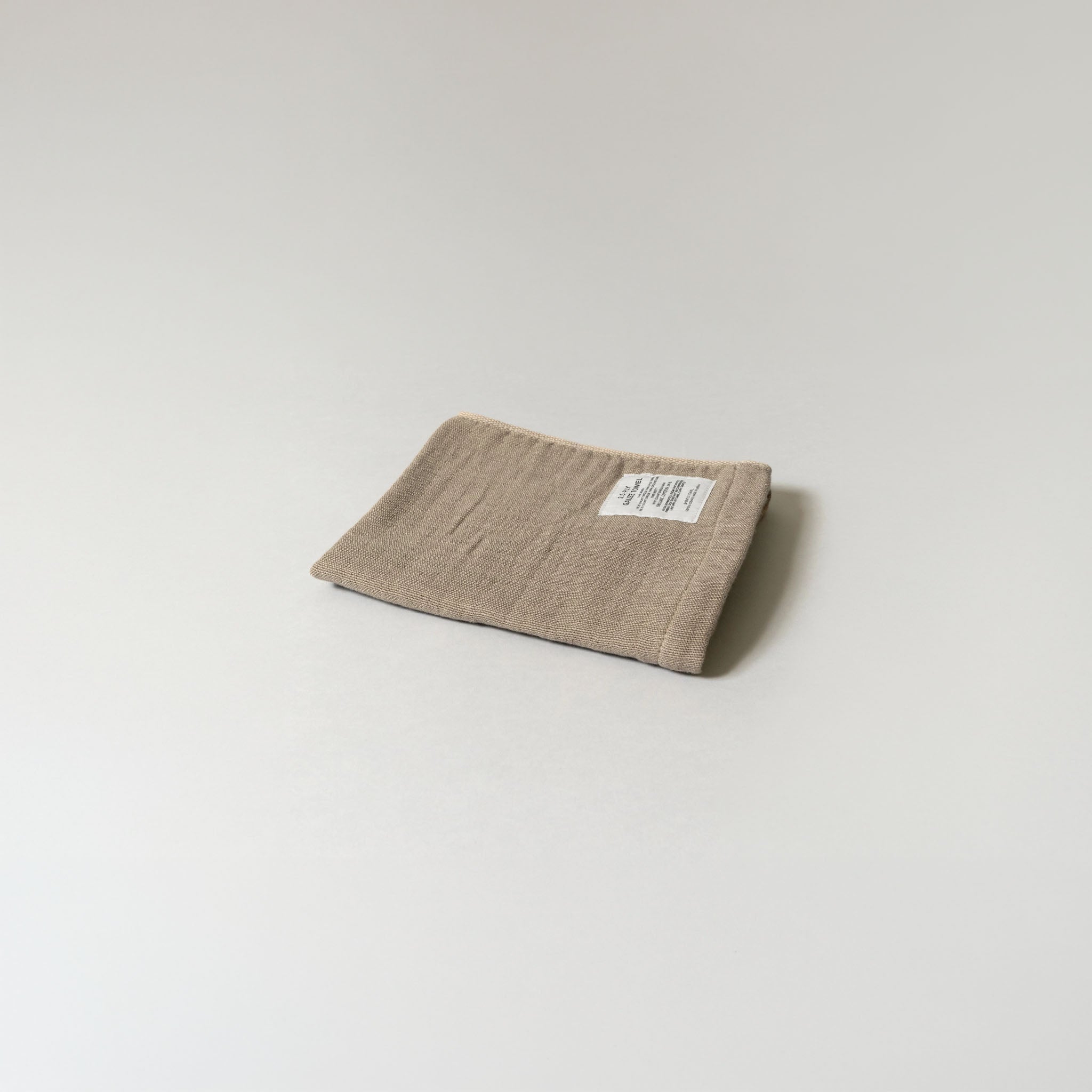 Beige 2.5-Ply Gauze Kitchen Towel folded on a light grey background
