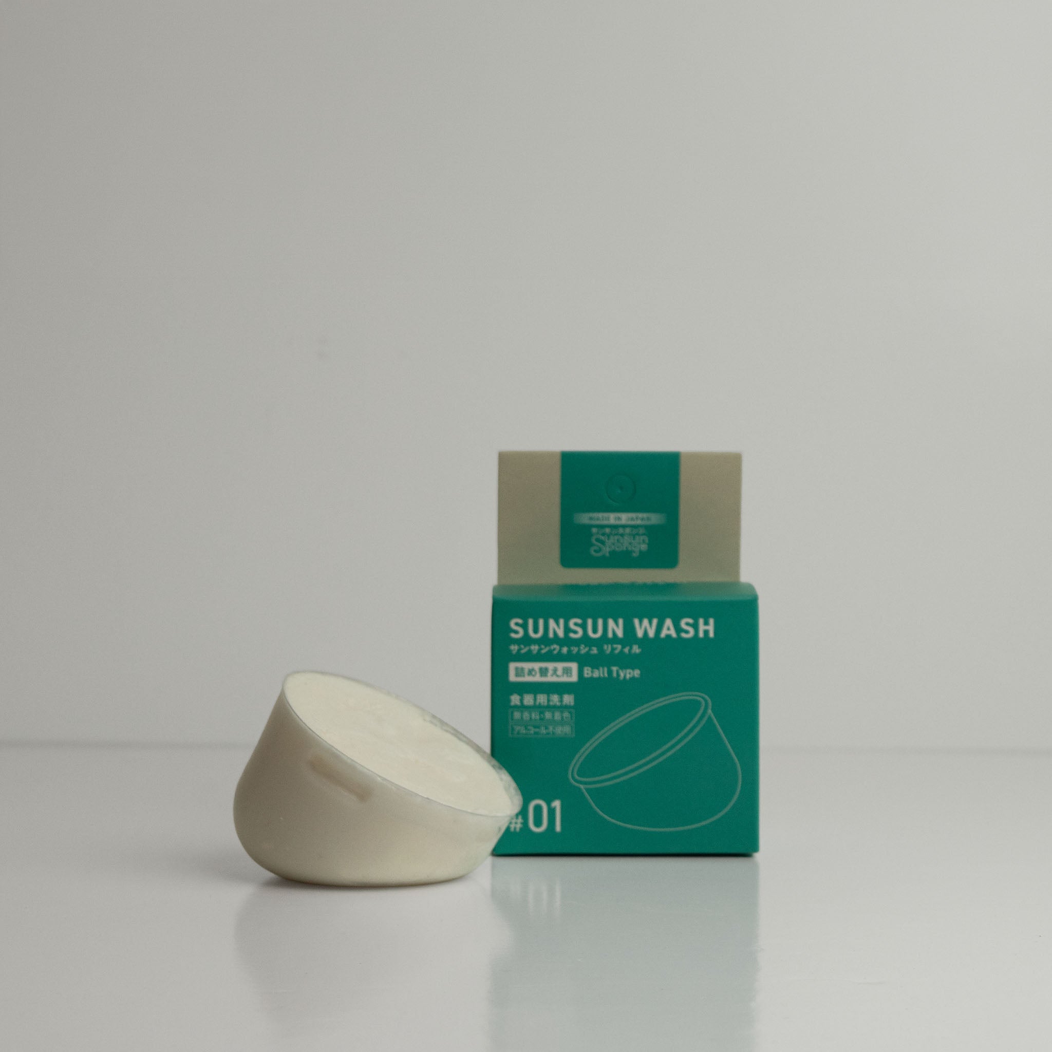 Side view of the Sunsun was ball type refill and its packaging box on a light grey background