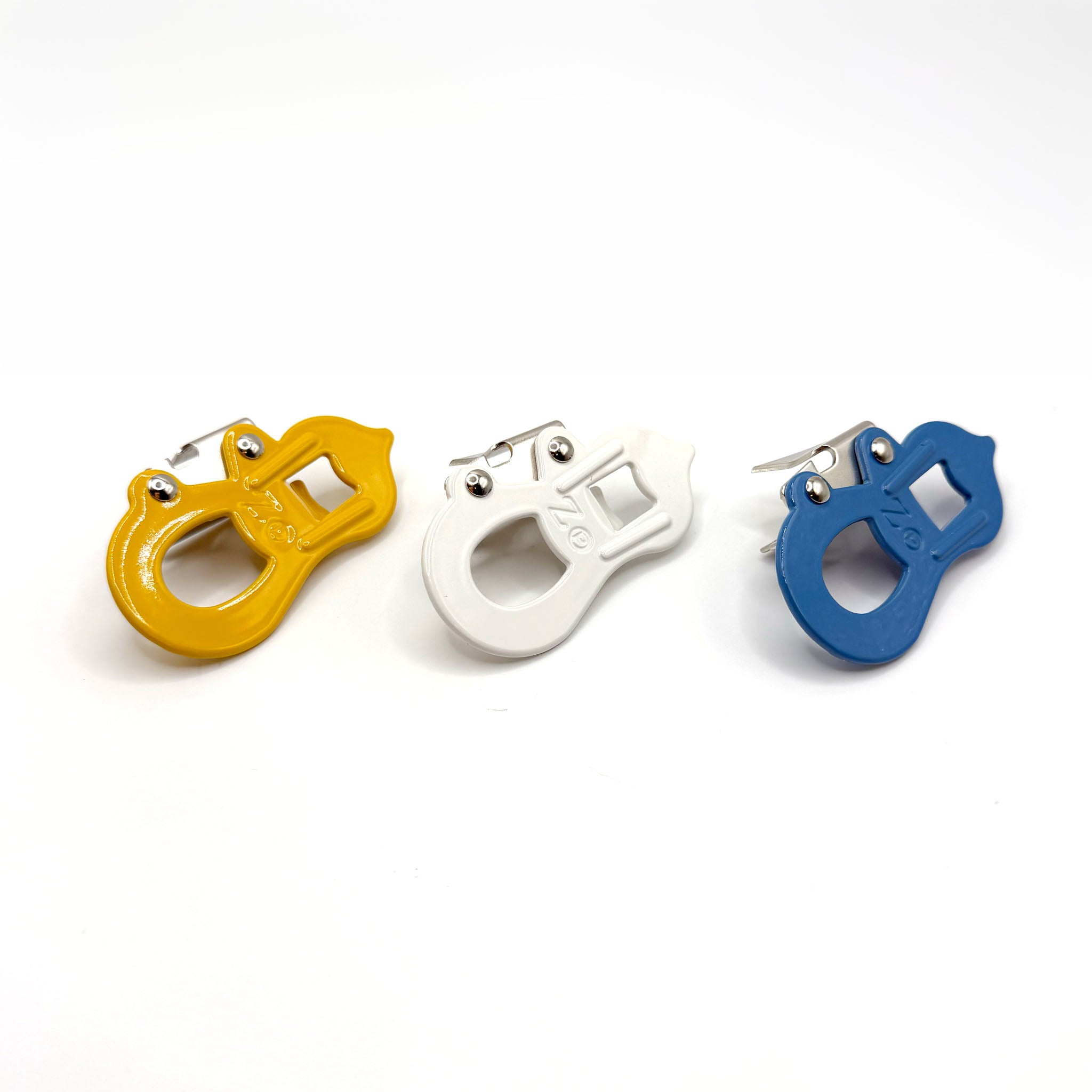 Three colorful Yamatani Hyotan Can Openers - yellow, white and blue on a white background