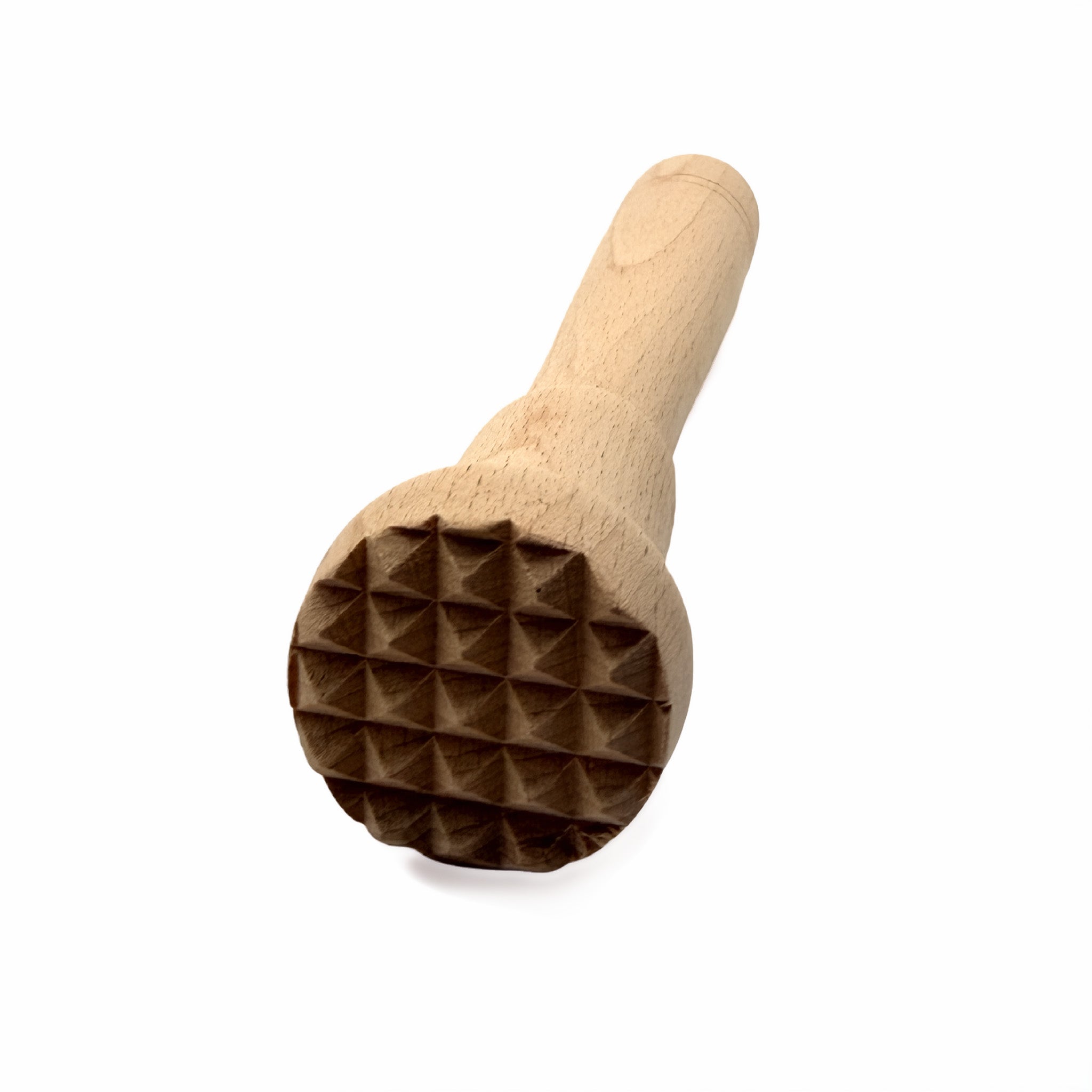 Close up of wooden muddler with textured surface on a white background