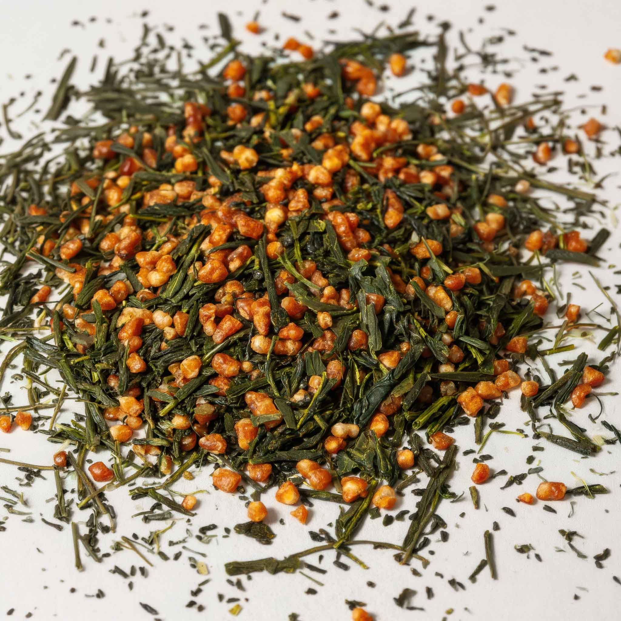 Dry genmaicha leaves on a white background