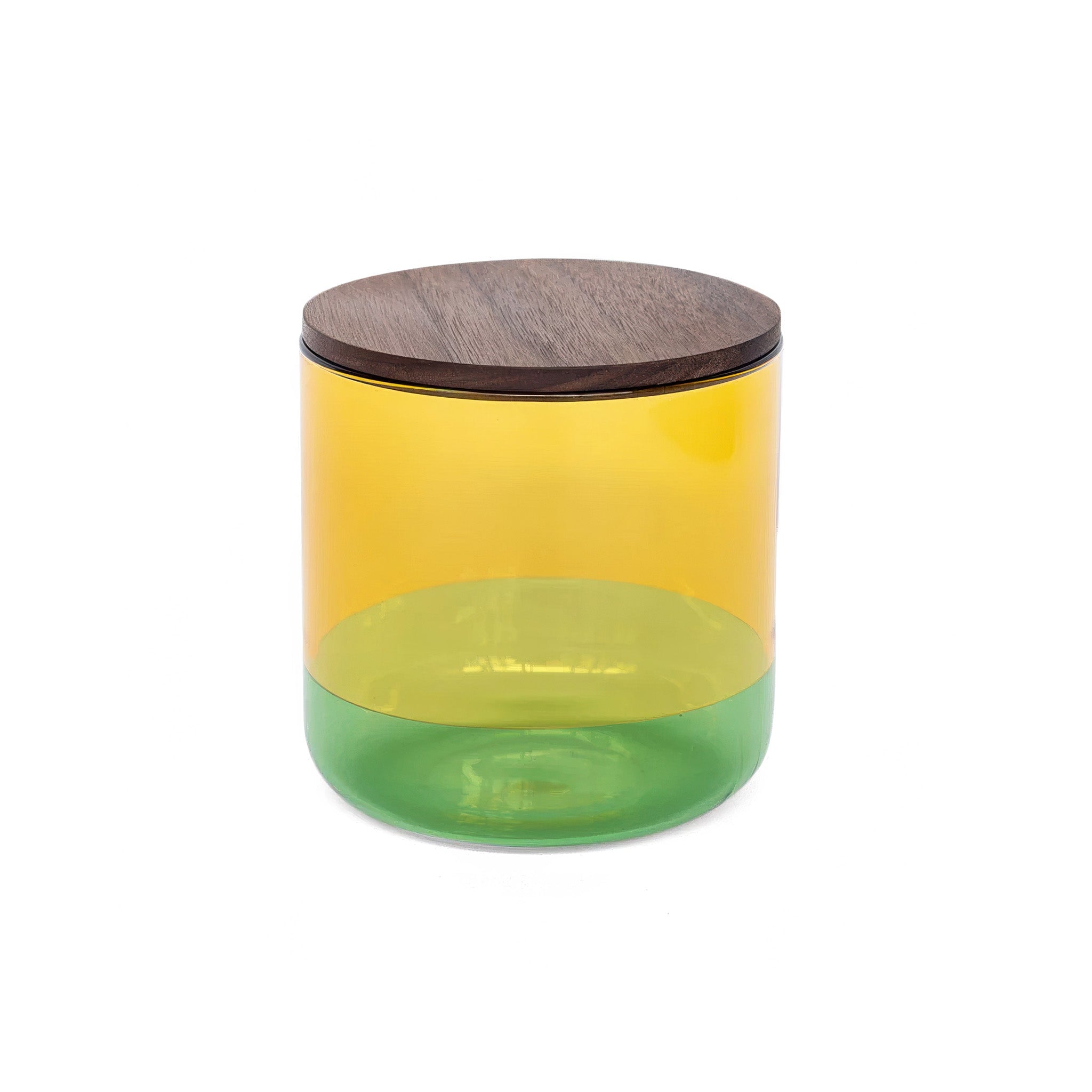 Yellow and green cylindrical glass canister with a wooden lid on a white background