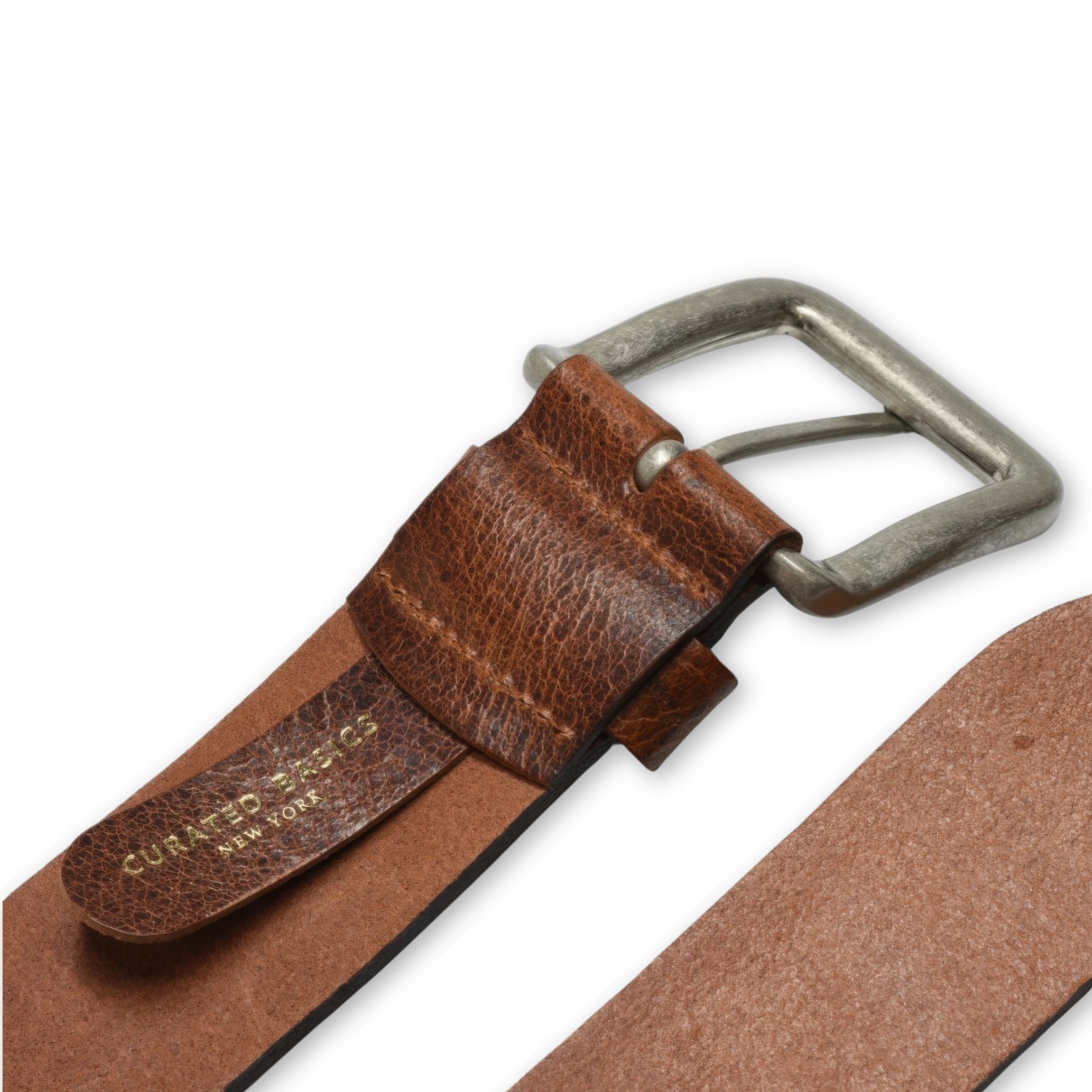 Brown leather belt with silver buckle on a white background