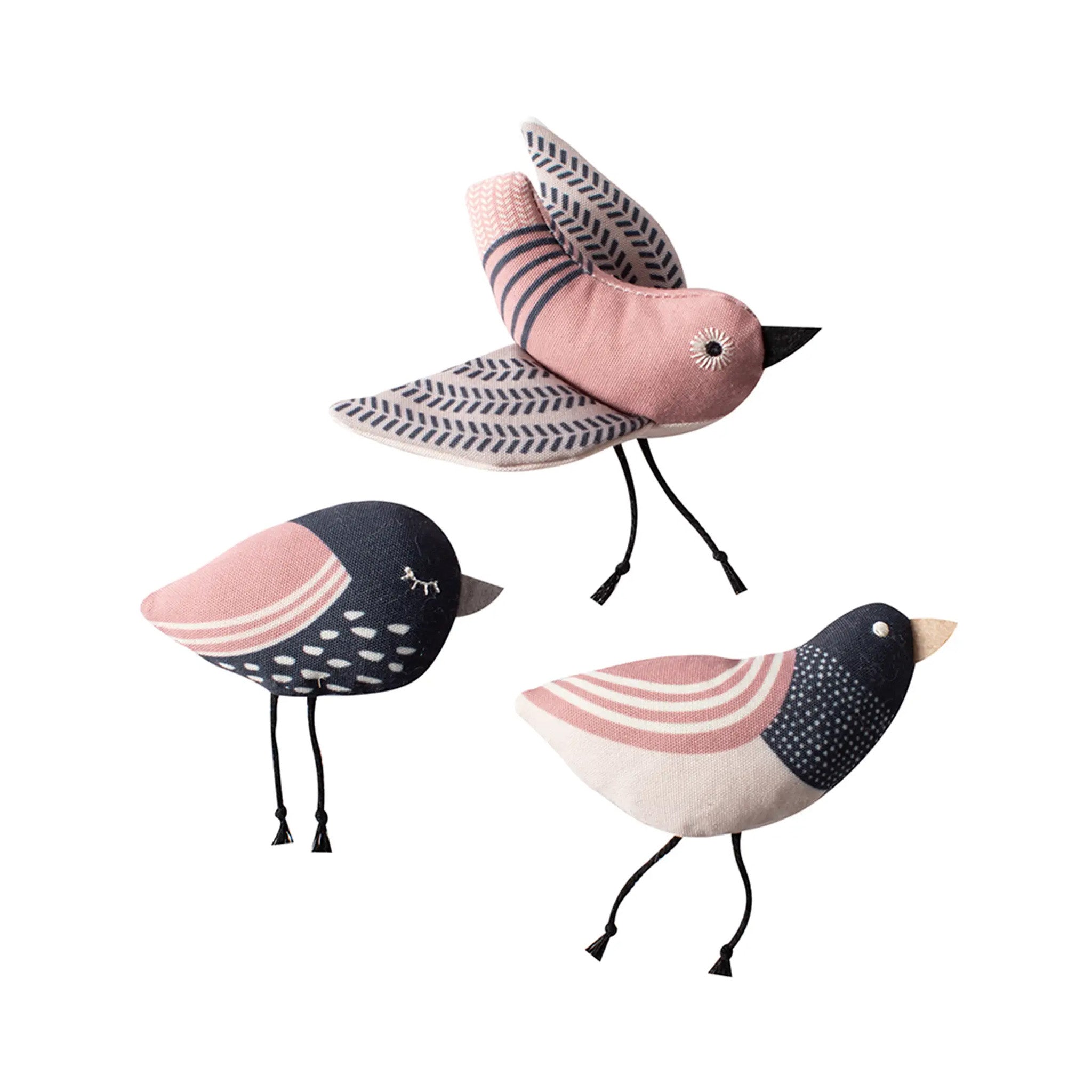 Three pink, black, and white patterned cat toys on a white background