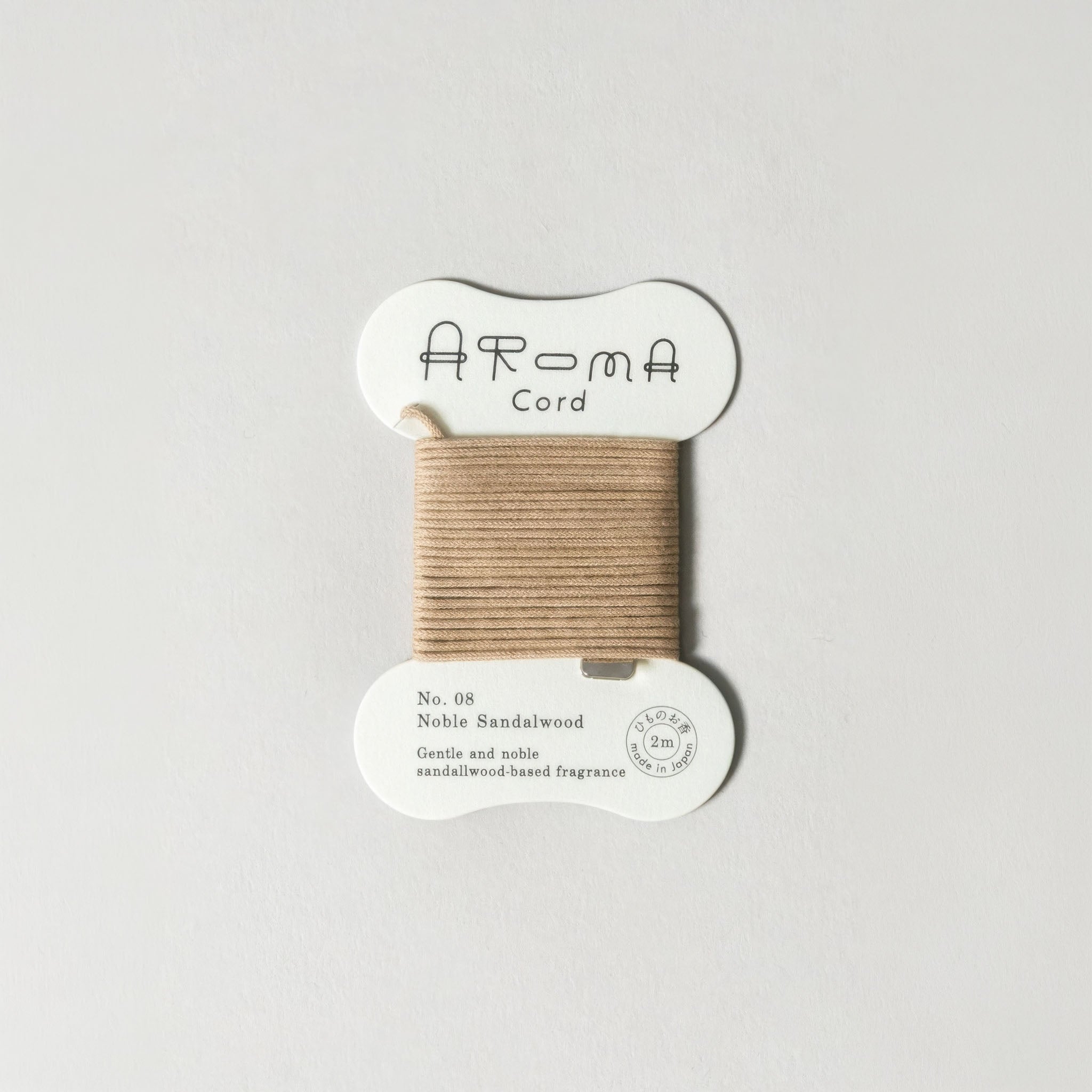'Aroma Cord' No. 08 Sandalwood on a light gray background