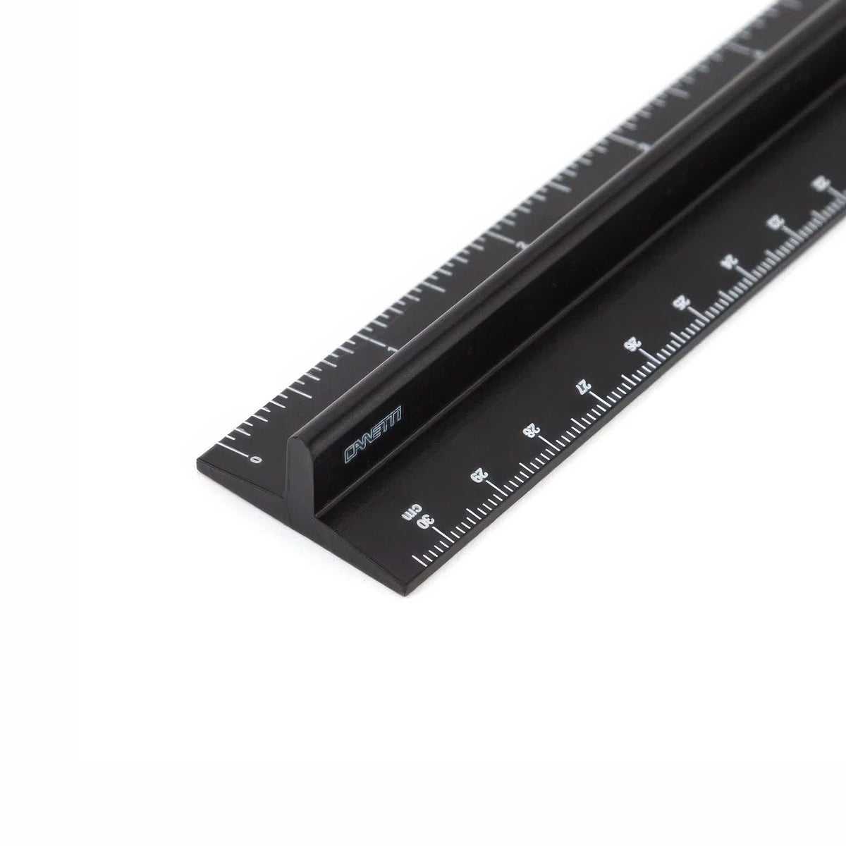 A black metal ruler with white measurement markings and the brand name 'CANETTI' printed on its side, shown on a clean white background.