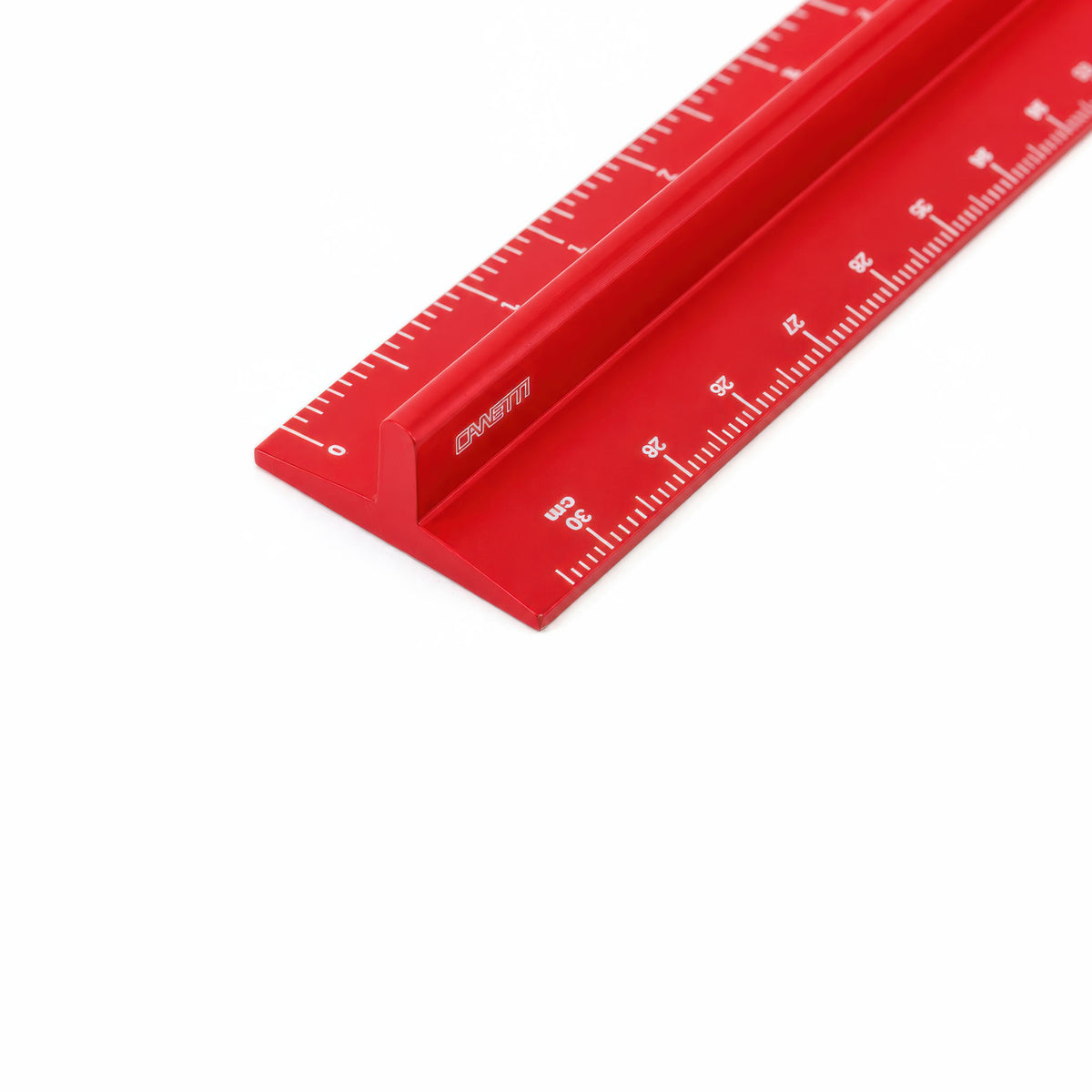 A red metal ruler with white measurement markings and the brand name 'CANETTI' printed on its side, shown on a clean white background.