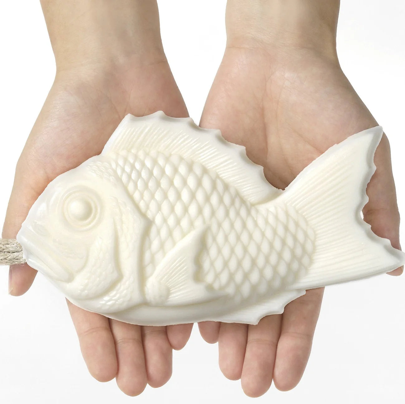 image of tamanohada welcome gift fish-shaped soap lily color in models hands