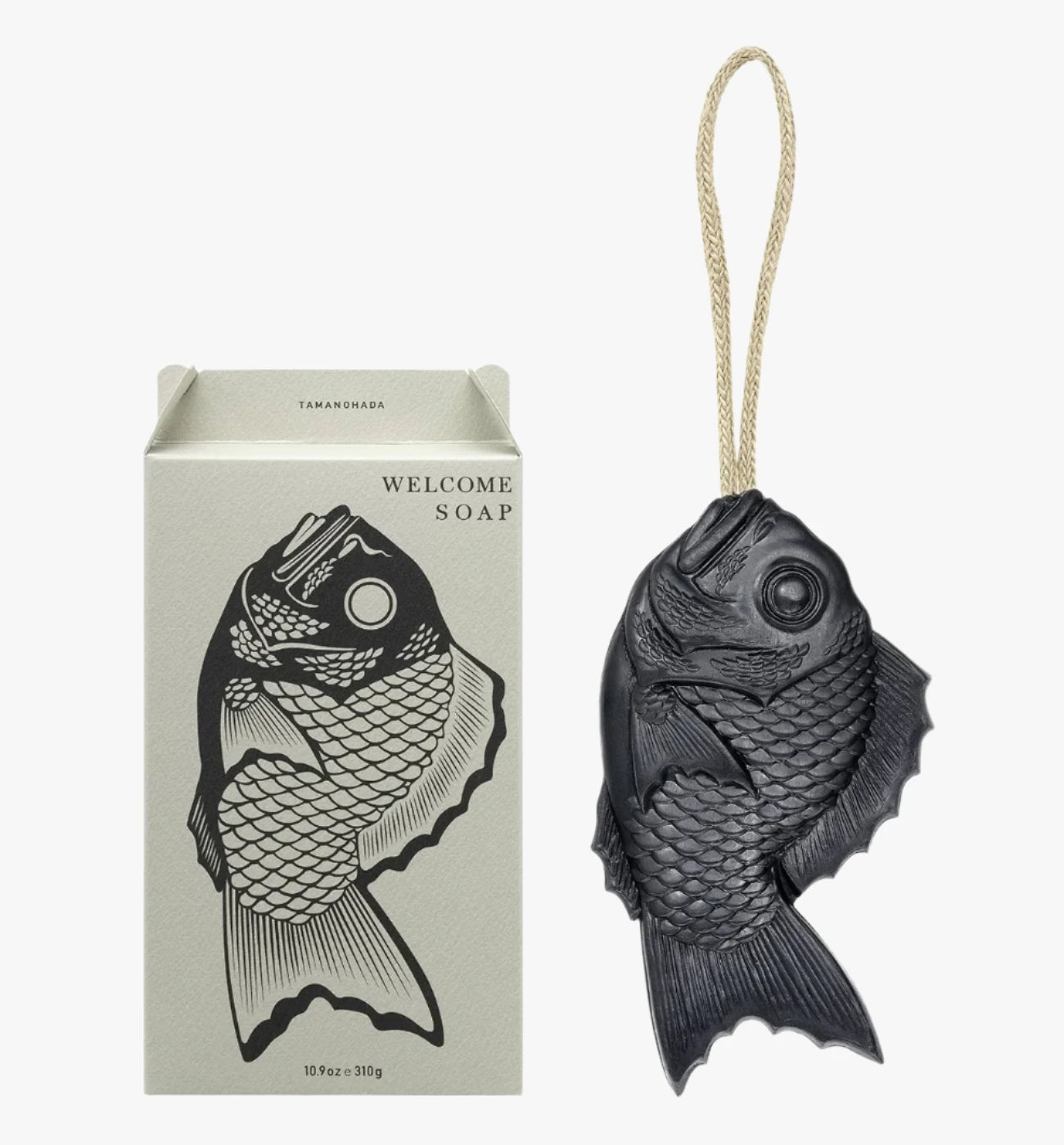image of tamanohada welcome gift fish-shaped soap pomogranite color next to box color Muscovado