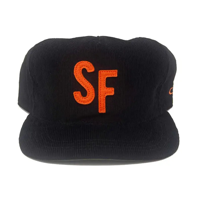 A black corduroy flat-brim cap featuring a prominent orange embroidered 'SF' logo on the front, set against a plain white background.