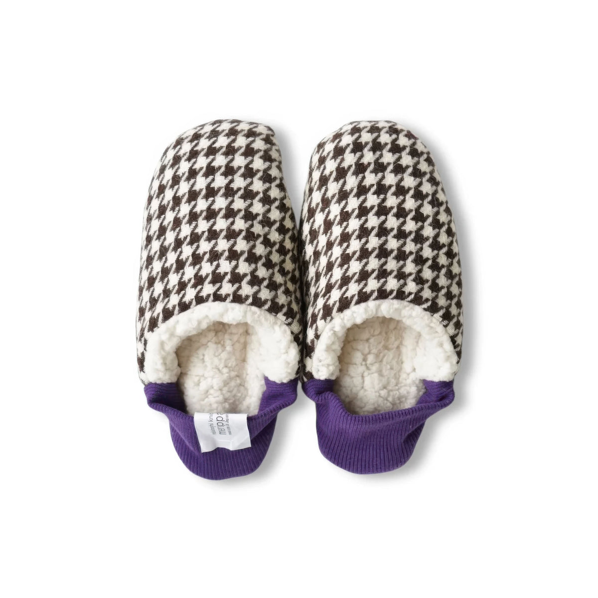 A pair of Merippa slip-on slippers with a brown and cream houndstooth pattern, a plush cream sherpa lining, and purple ribbed trim at the opening, shown on a white background.