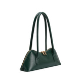 Angled view of the Dakota handbag in green on a white background