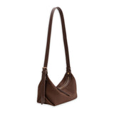 Brown handbag with strap adjusted on a white background