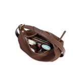 Brown leather bag with compartments on a white background