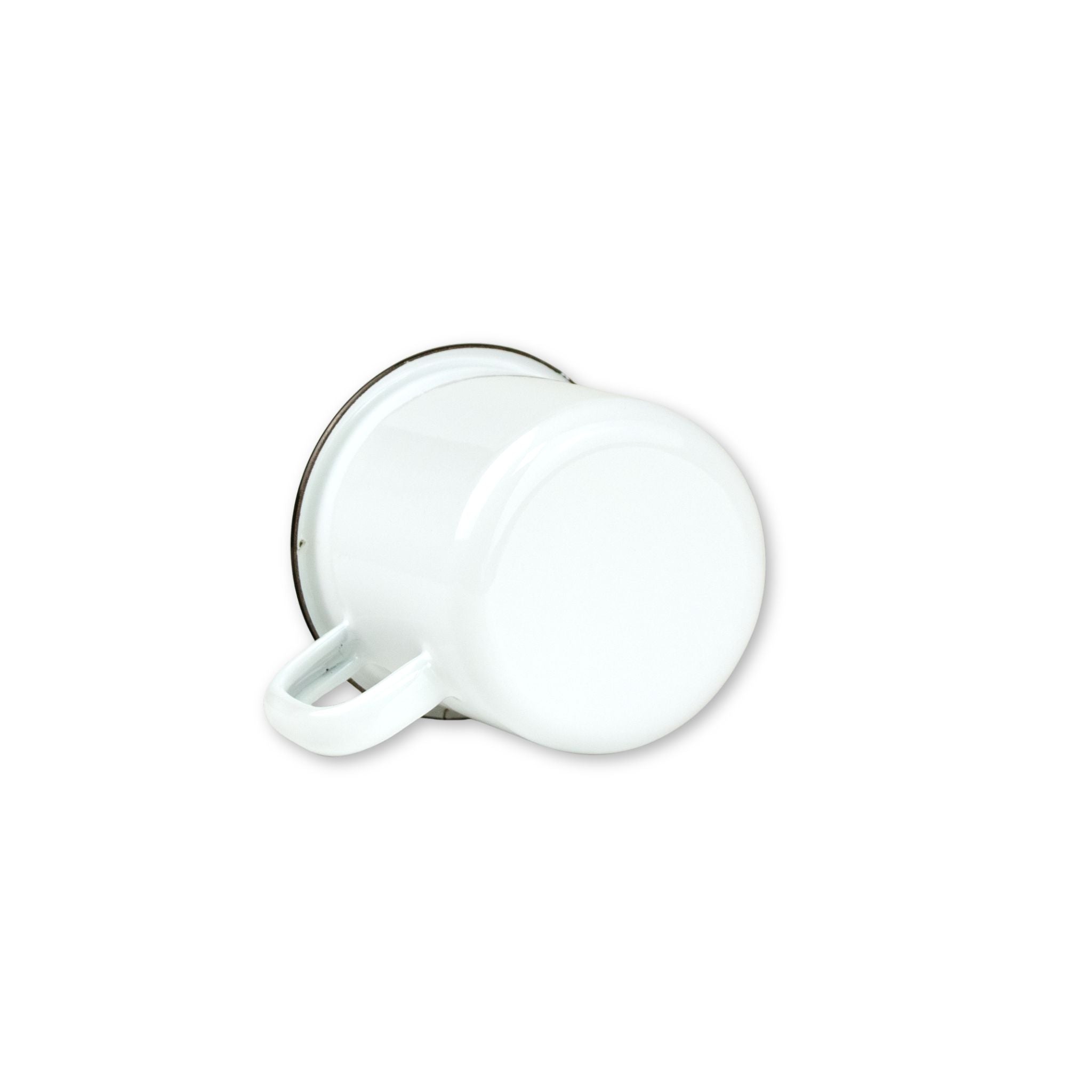 White mug with a black rim on a white background