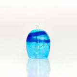 Blue glass wind chime on a white background