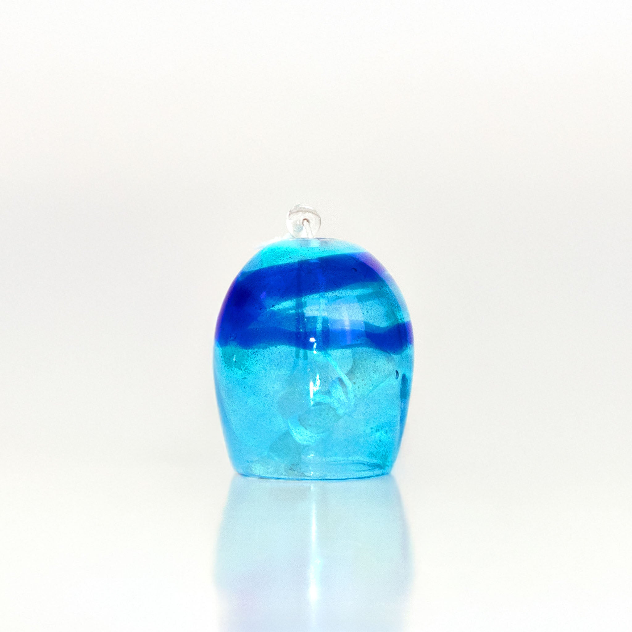 Blue glass wind chime on a white background