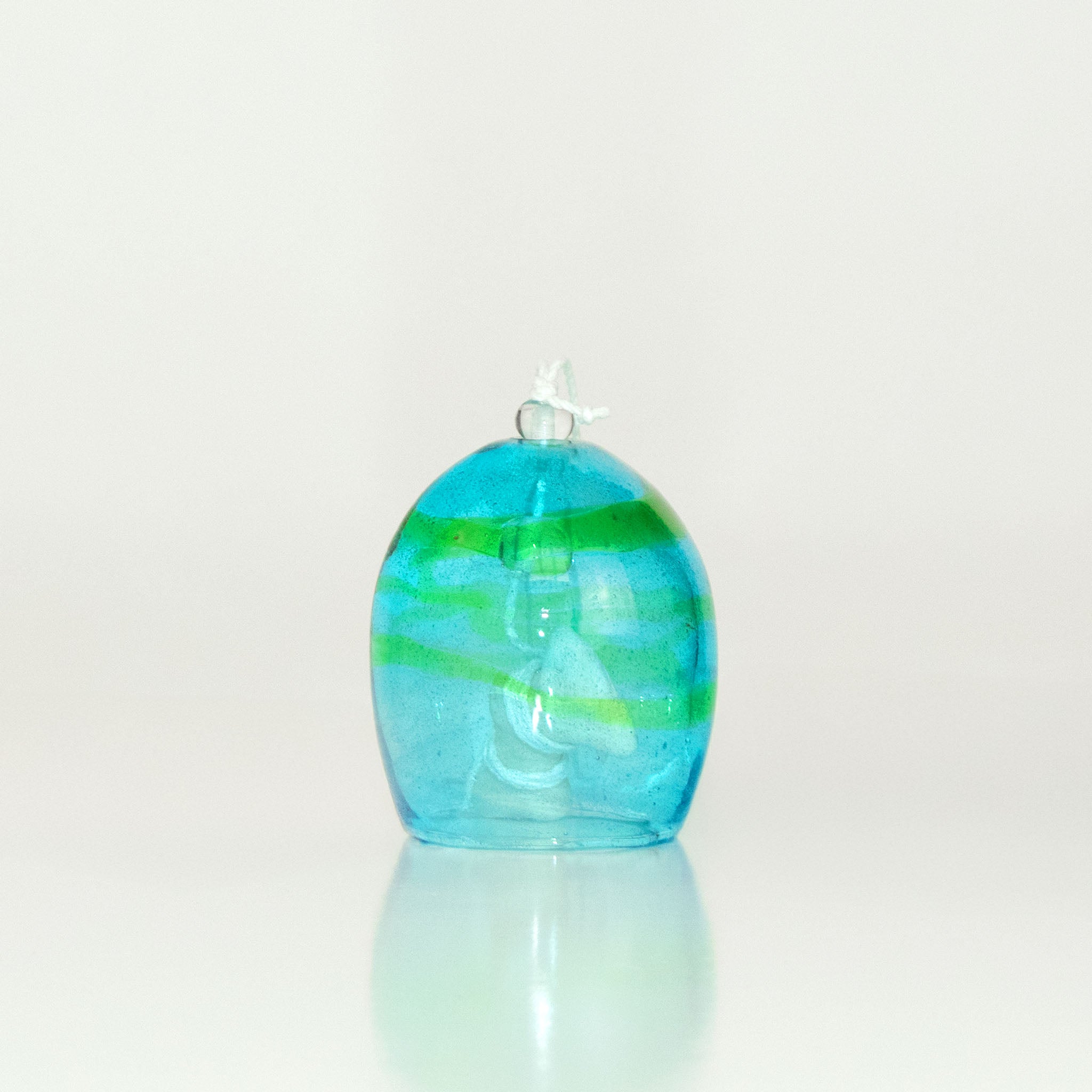 Blue and green glass wind chime on a white background