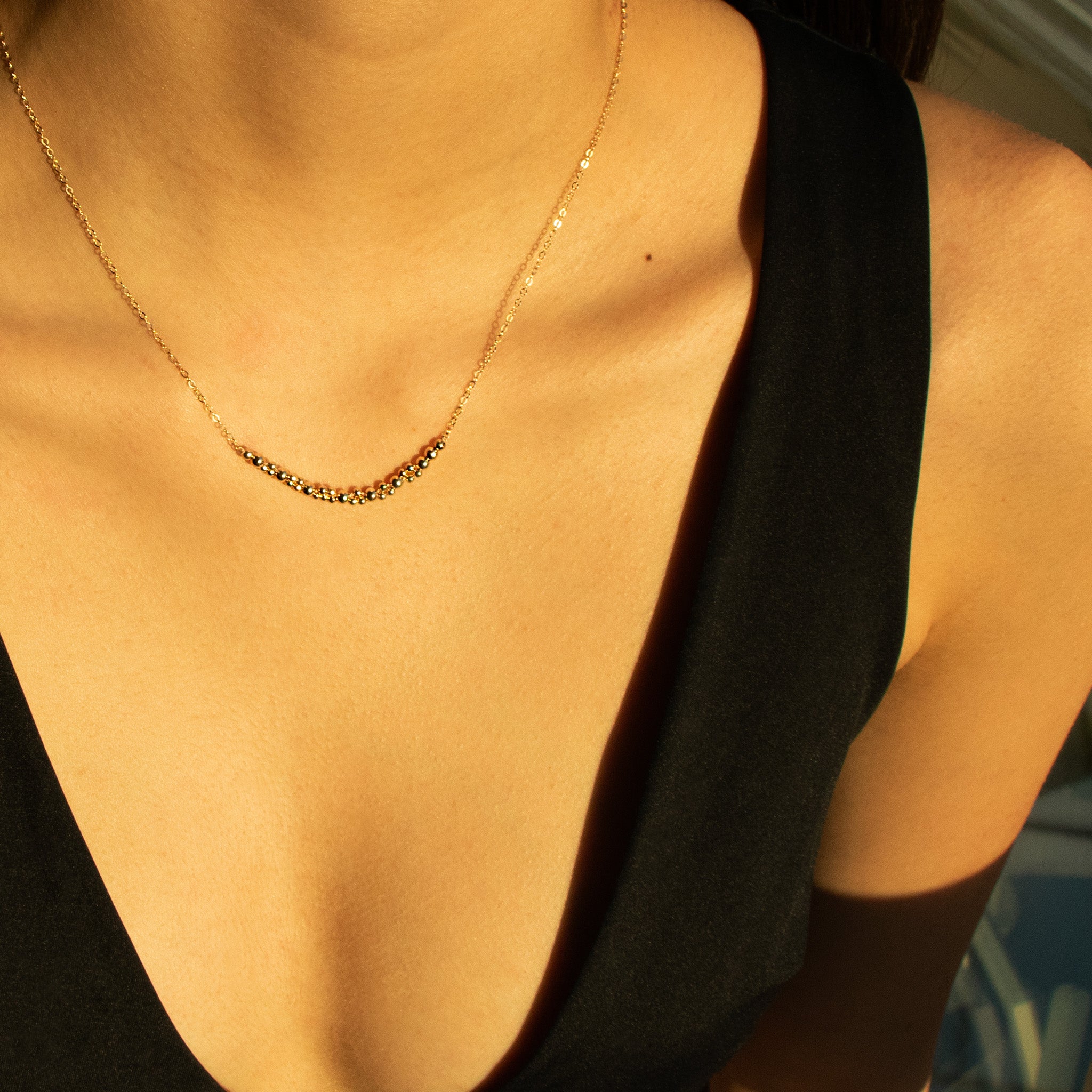 image of model wearing abacus row necklace columba golden color