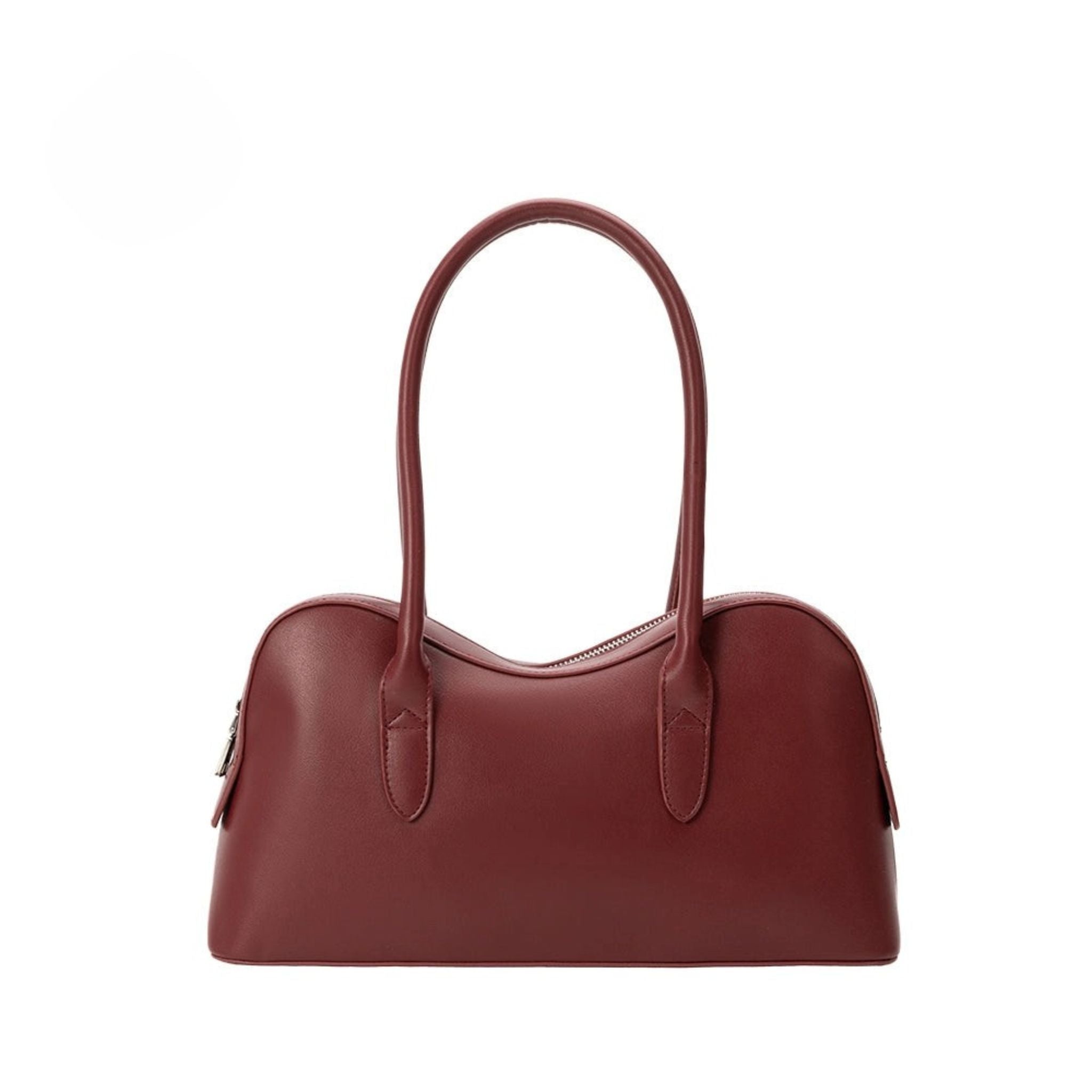 Burgundy handbag with a handle on a white background