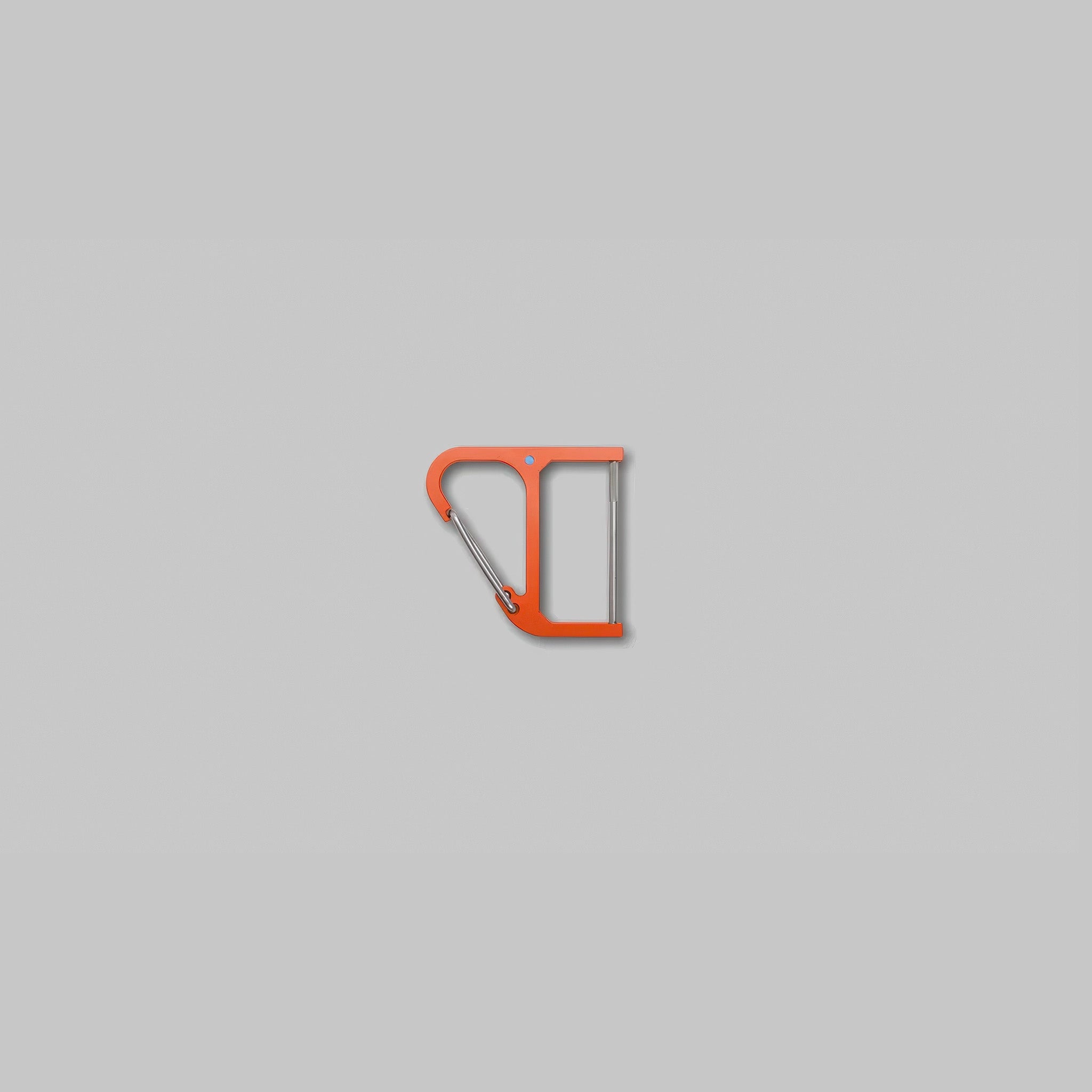 CW&T's orange titanium key wrangler against a light grey background