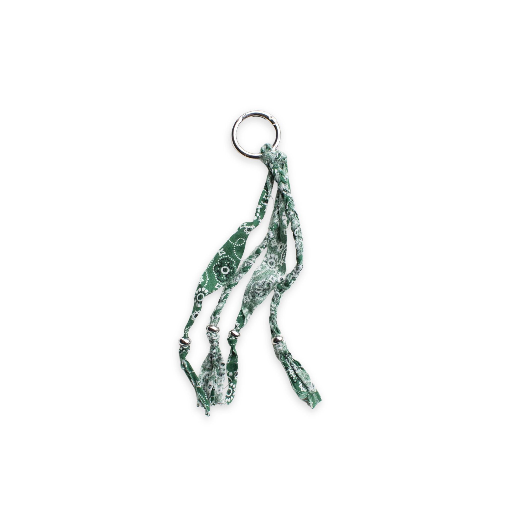 Green bandana patterned keychain or bag charm on a white background
