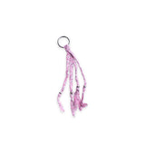 Pink bandana patterned keychain or bag charm on a white background