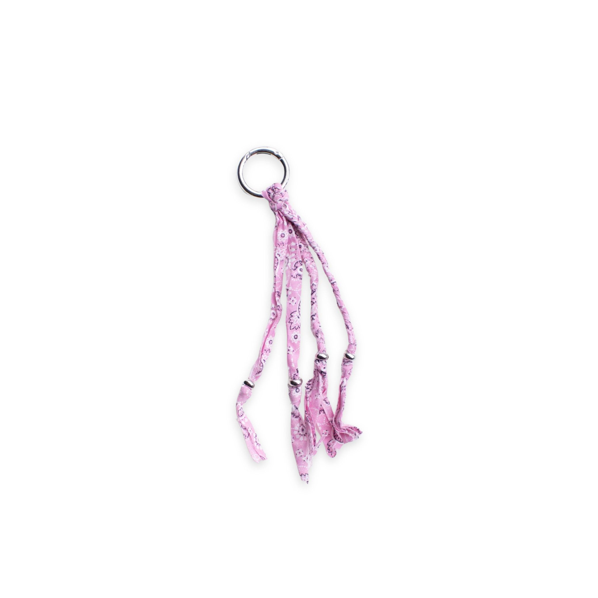 Pink bandana patterned keychain or bag charm on a white background