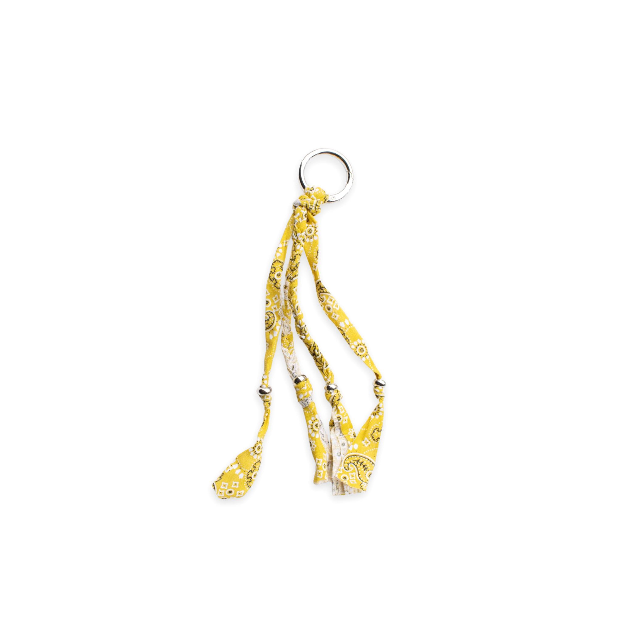 Mustard bandana patterned keychain or bag charm on a white background