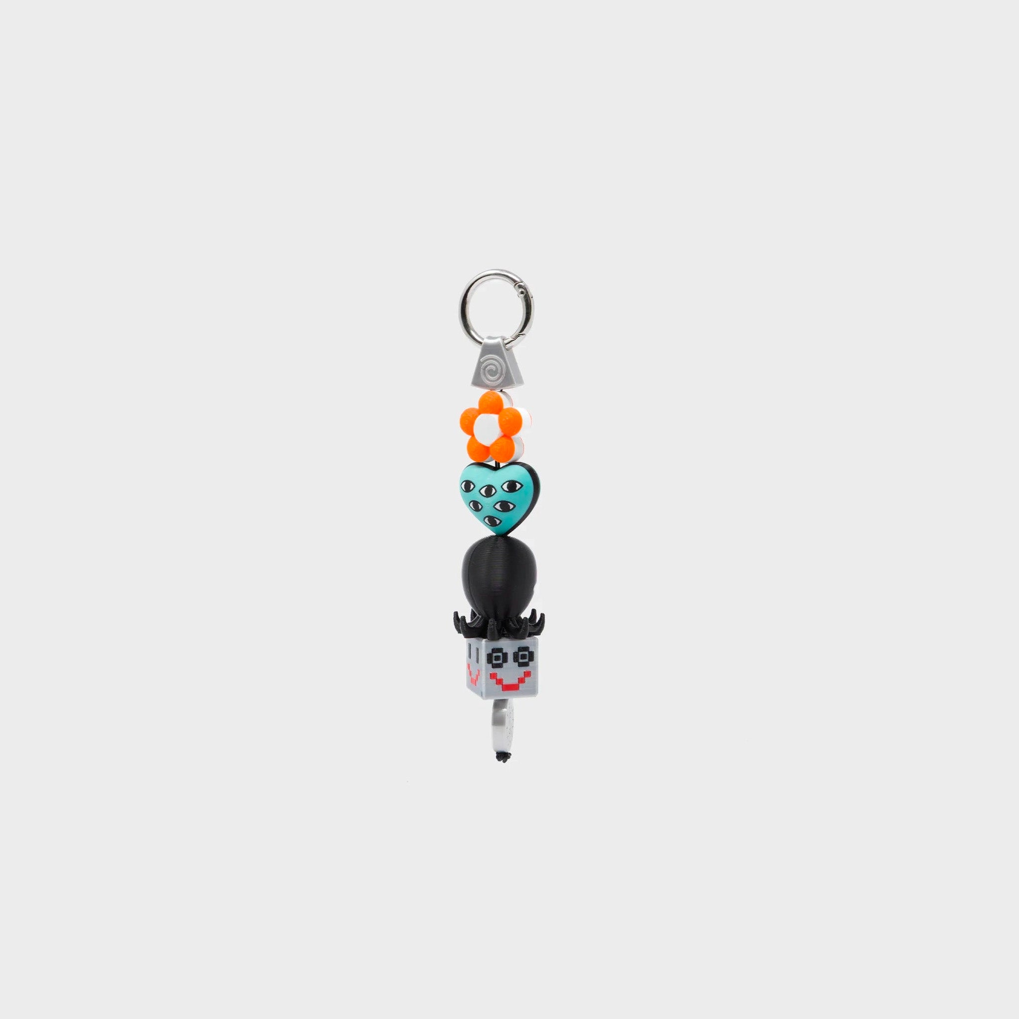 Min & Mon's Bloomoo Charm - Orange and Blue 3D Printed Bioplastic Keychain on a white background