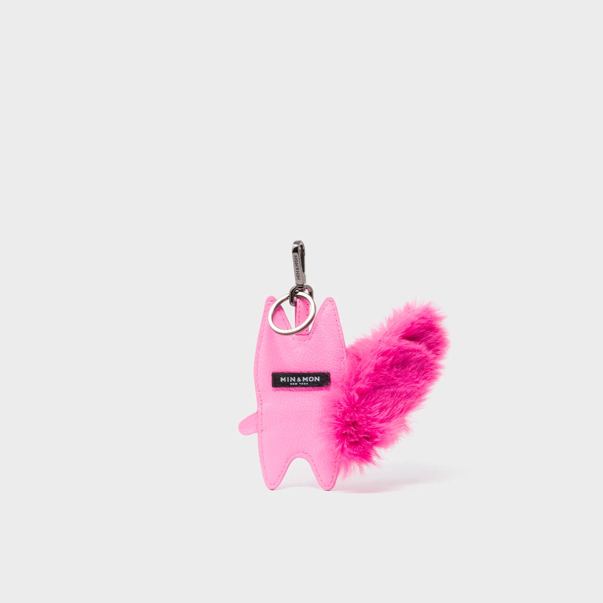 Back of Min & Mon's Flufftail Charm - Bubblegum Pink Leather Keychain on a white background