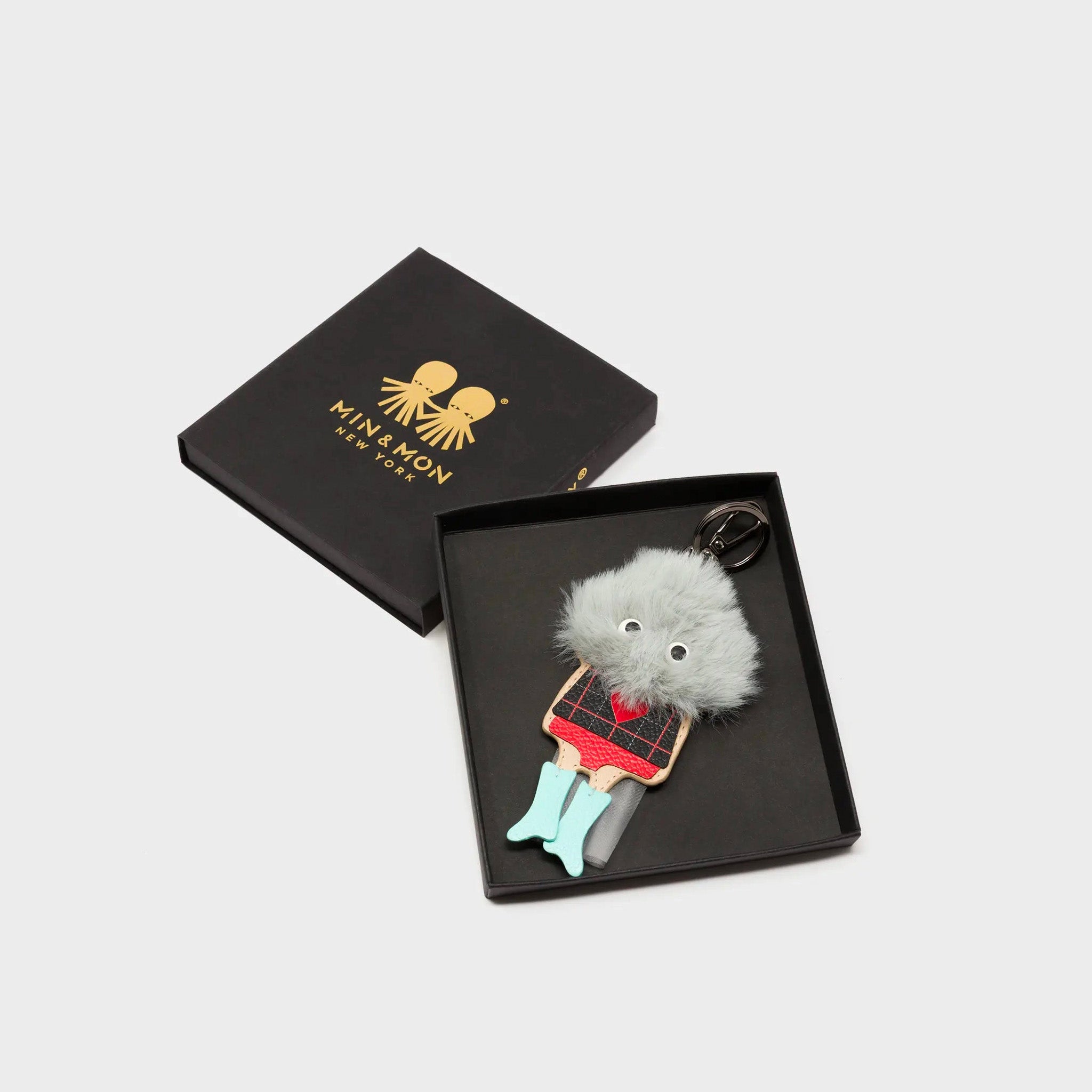 Min & Mon's Monster Charm - Gray Faux Fur and Aquatic Blue Leather Boots in its retail packaging box