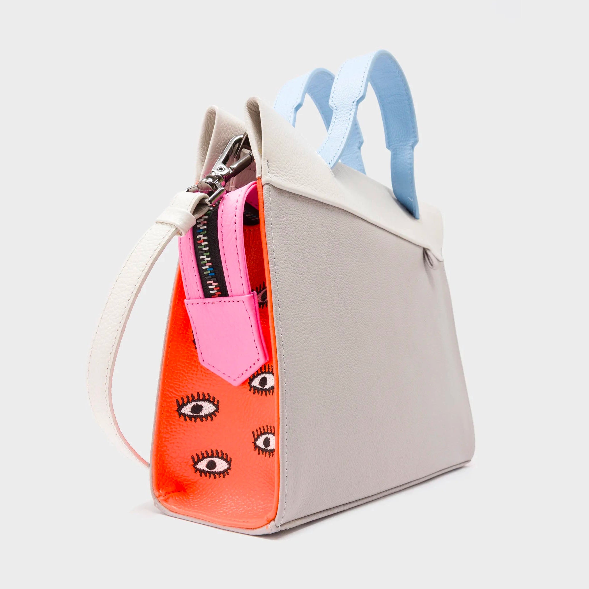 Angled view of Min & Mon's Vali Crossbody Small Gray Leather Bag - All Over Eyes Embroidery