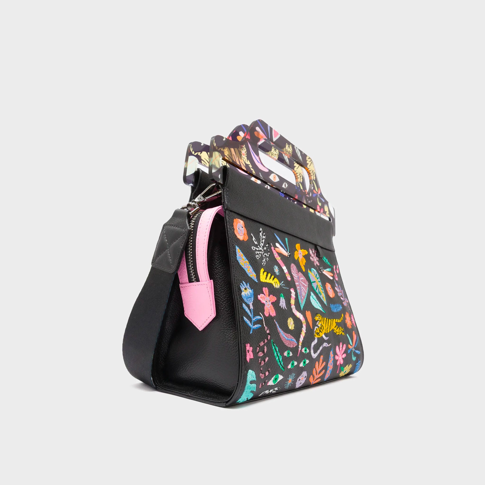 Colorful handbag with floral pattern on a light gray background